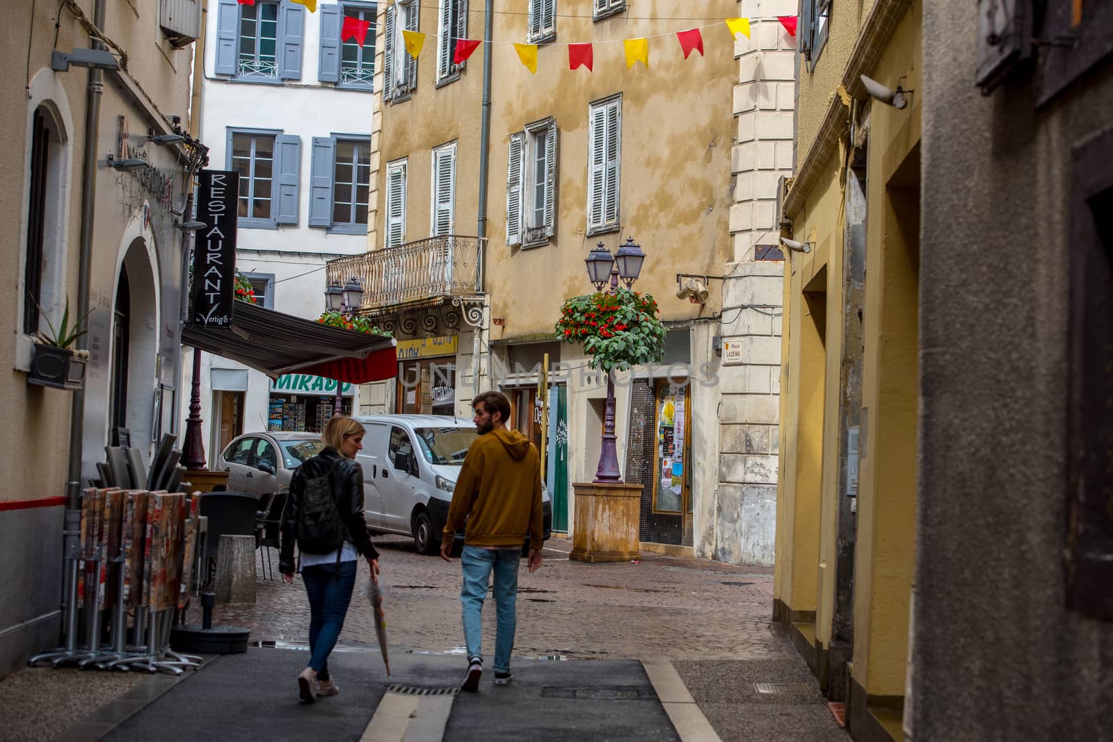 Foix, France :  2020 09 Sept, : People walk in the street of the village Foix in the south of France, Europe