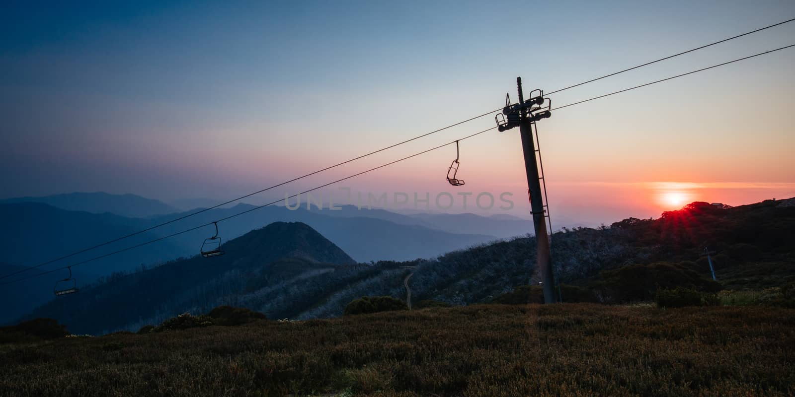 The view at sunset from the summit of Mt Buller over Little Buller Spur in the Victorian High Country, Australia