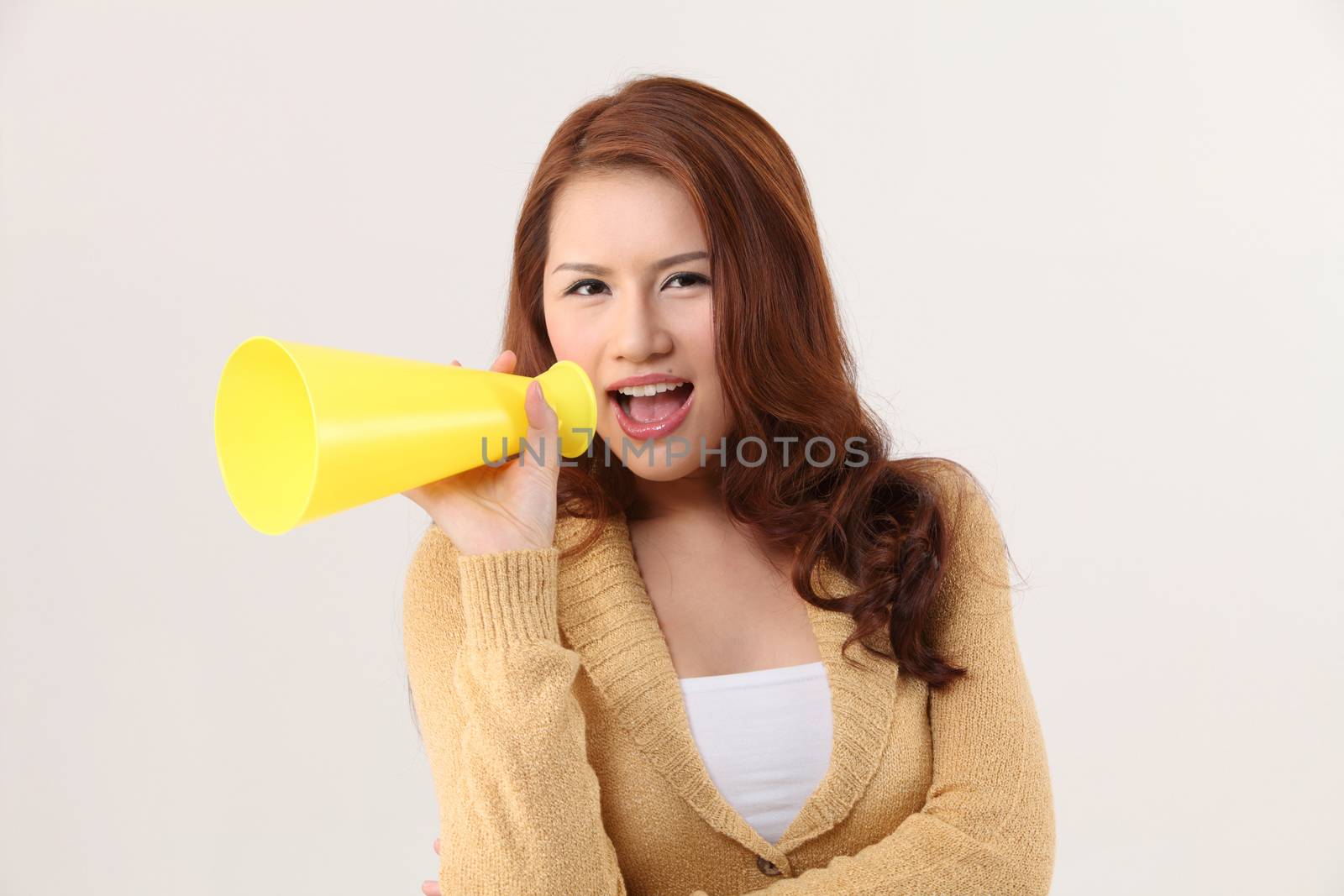 Woman screaming into bullhorn