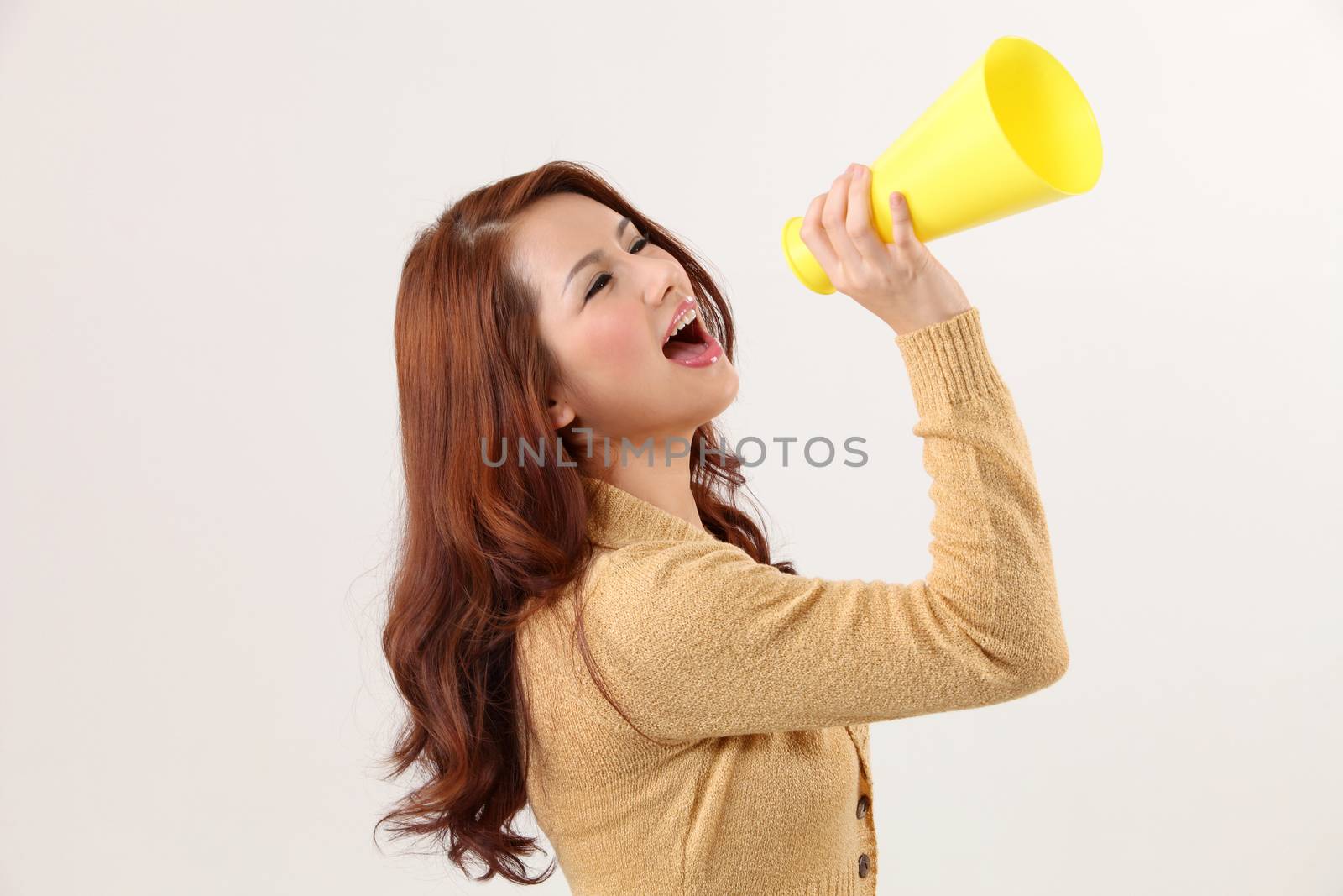 Woman screaming into bullhorn
