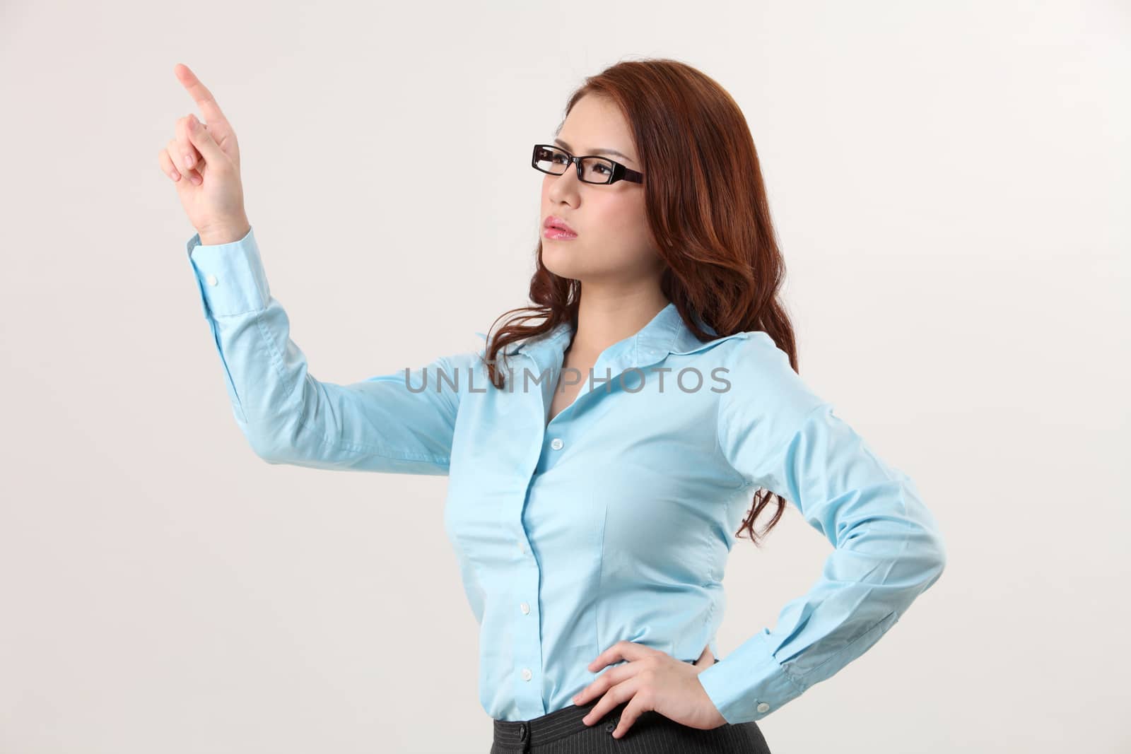 Businesswoman using large transparent touch screen
