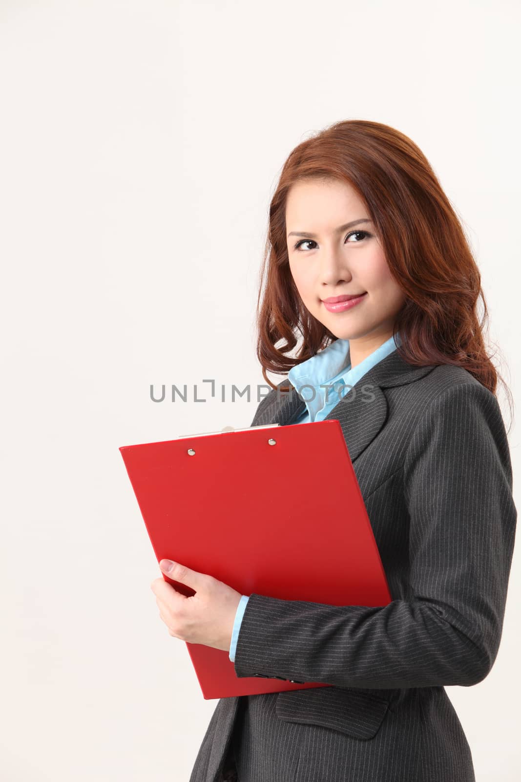 woman holding a red clip board