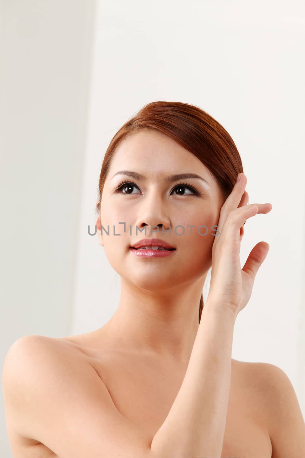  Woman Touching Her Face on the white background