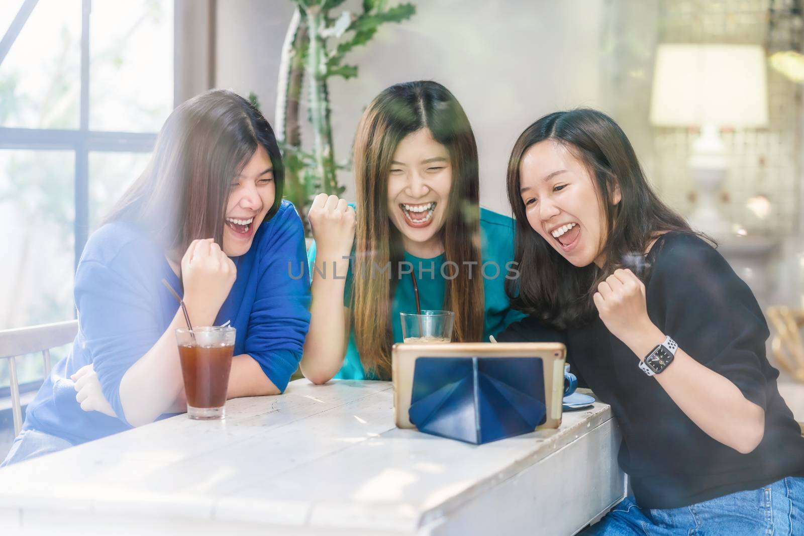Group of Three asian businesswoman freelancer working with succe by Tzido