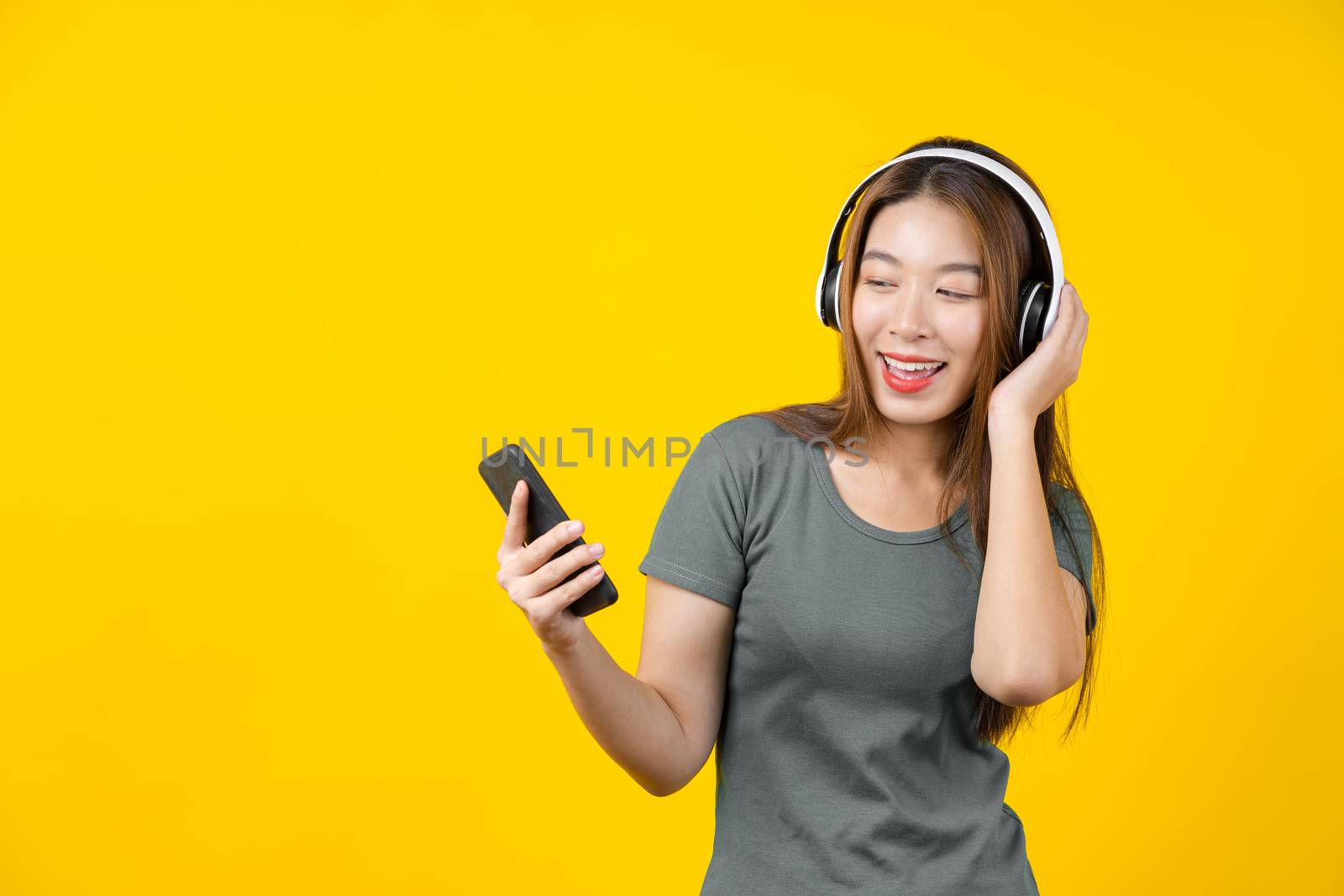 Happiness Asian smiling young woman wearing technology wireless by Tzido