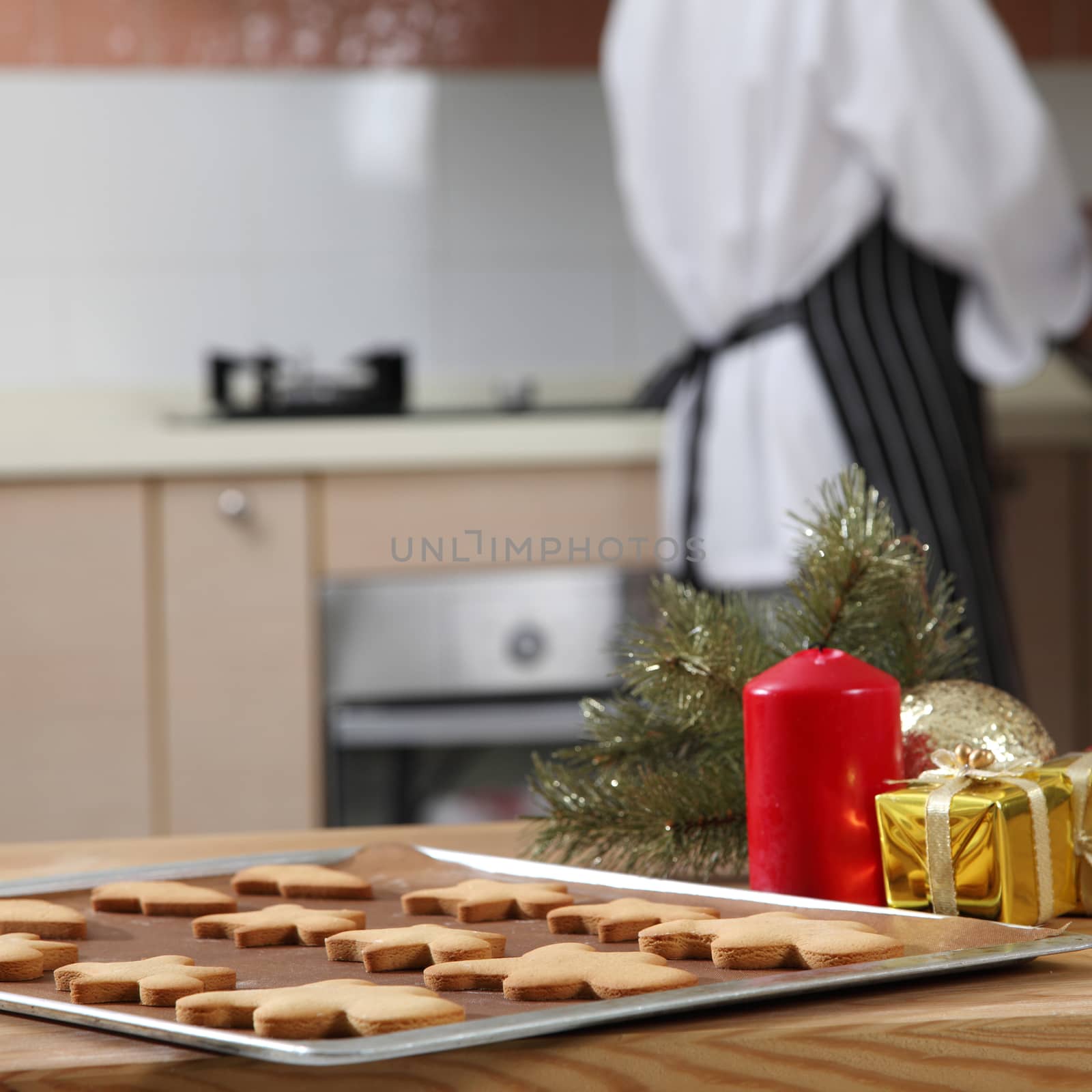tray of cookies and chef preparing icing sugar 