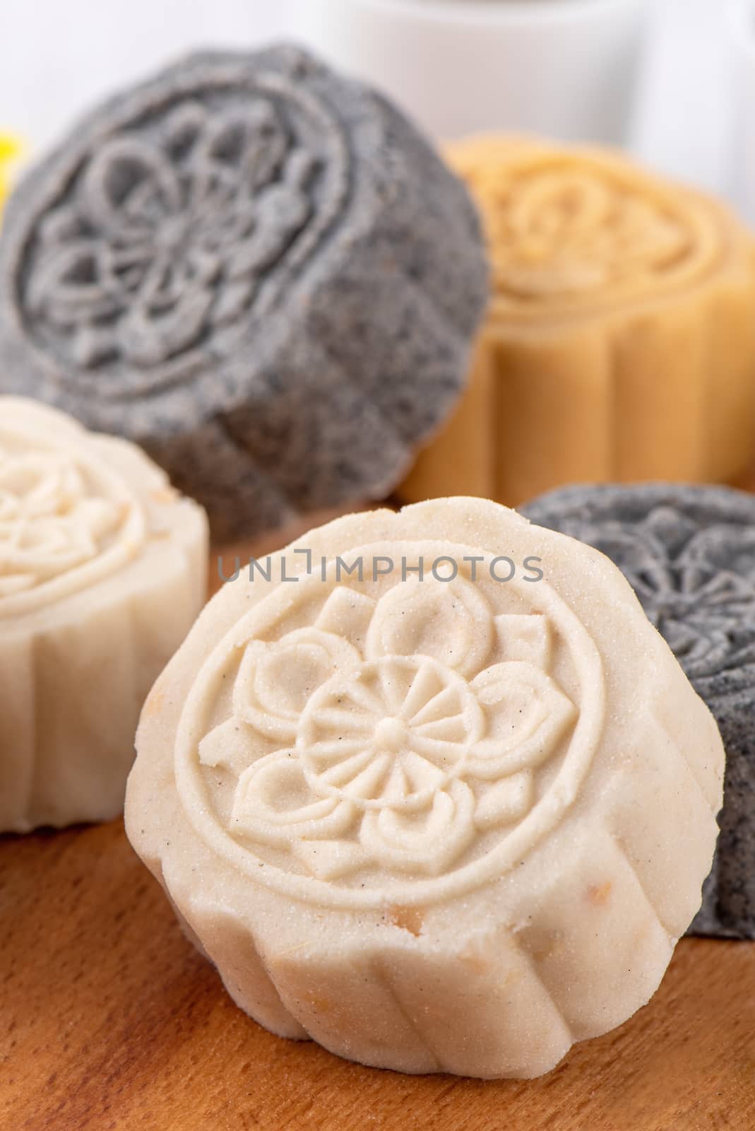 Colorful beautiful moon cake, mung bean cake, Champion Scholar Pastry cake for Mid-Autumn festival traditional gourmet dessert snack, close up.