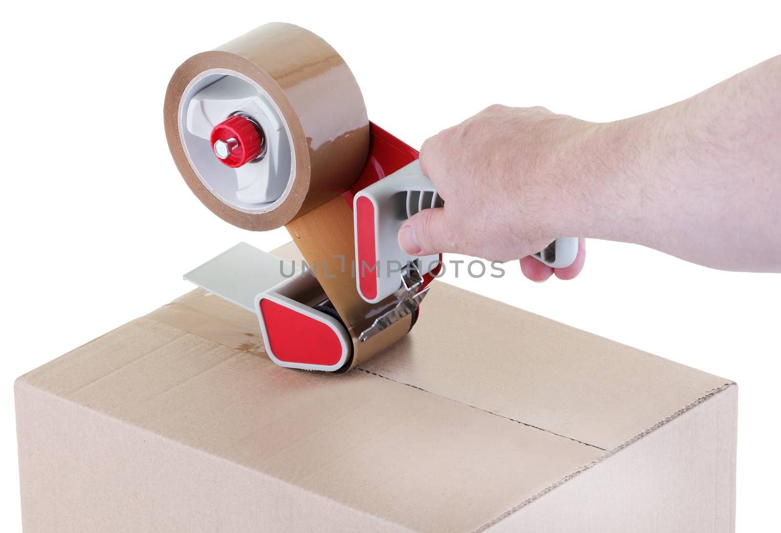sealing a shipping cardboard box with an adhesive tape dispenser
