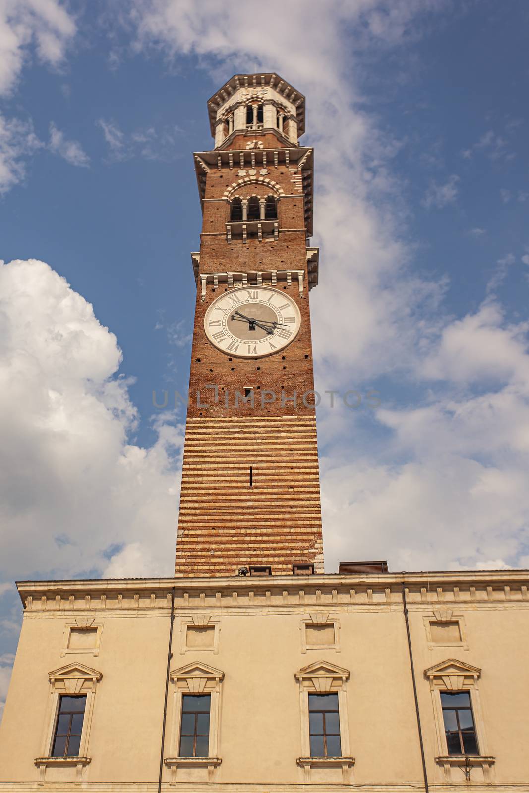 Lamberti tower in verona under a blue sky, vertical shoot
