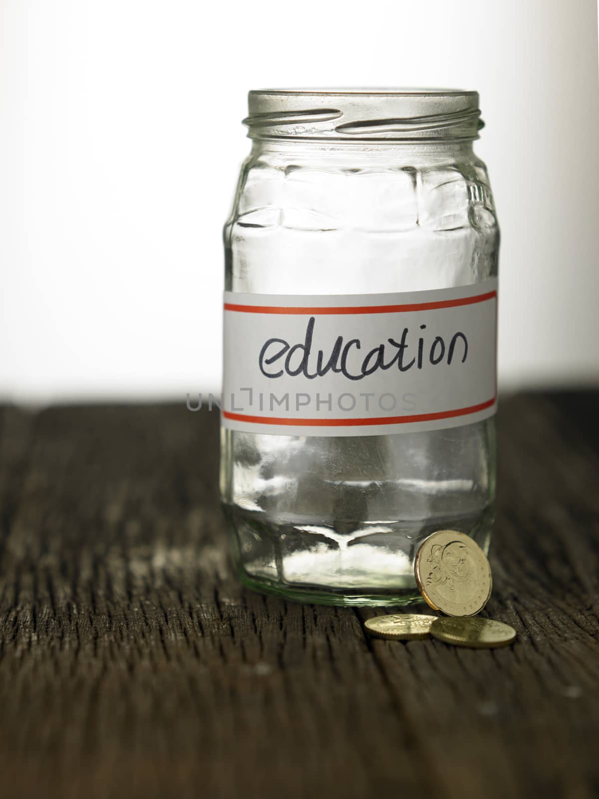 empty glass jar labelled with text education