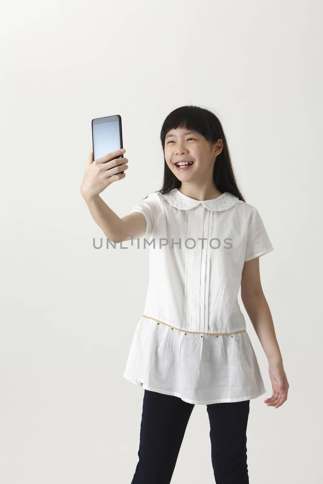 chinese girl self portrait with smart phone