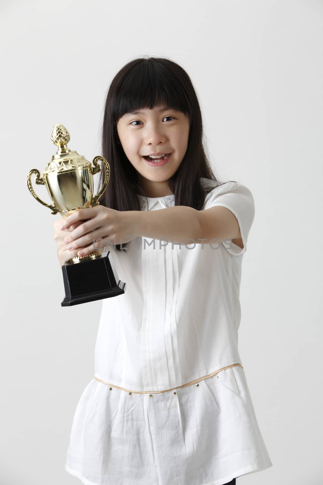 chinese girl holding trophy with both hands