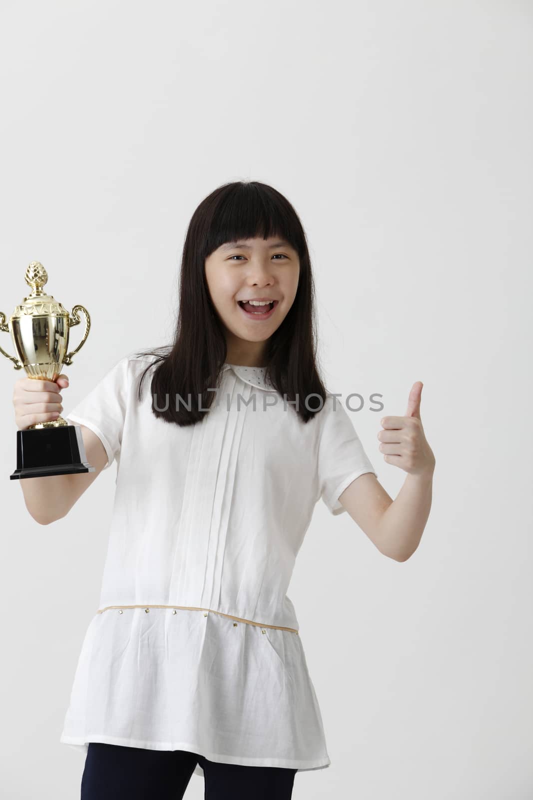 chinese girl holding trophy and with thumb up