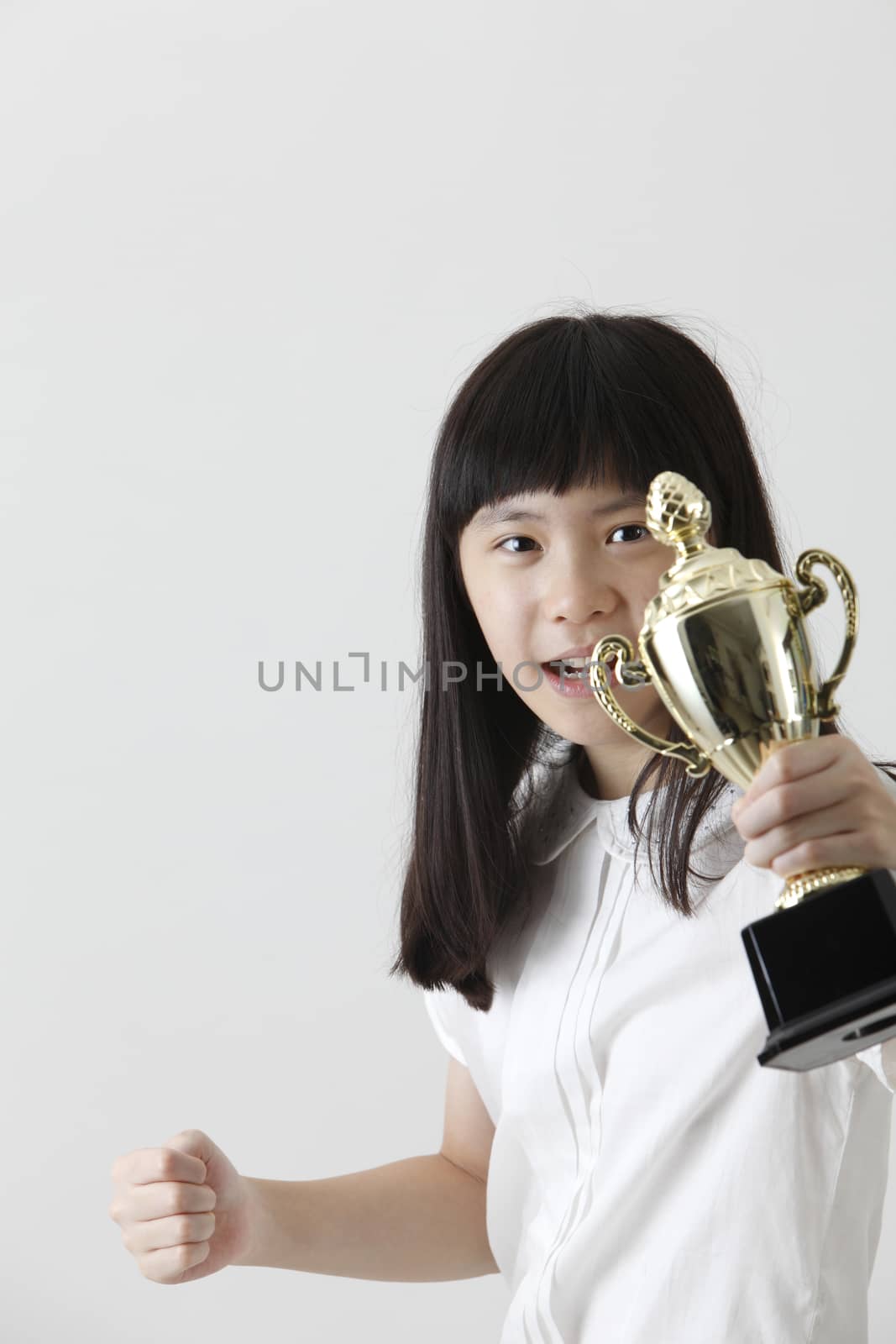 chinese girl showing her trophy