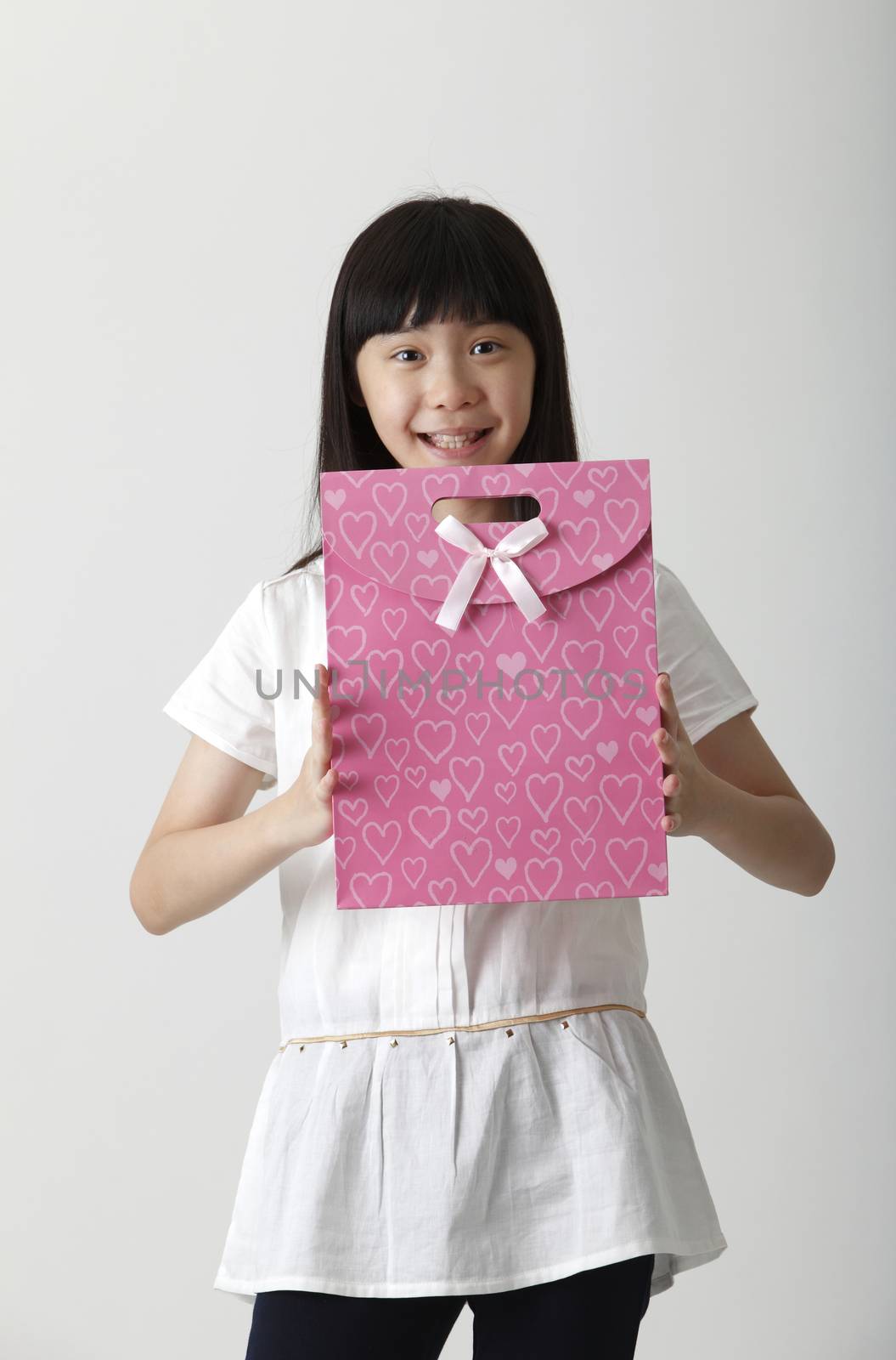 chinese girl holding a present bag