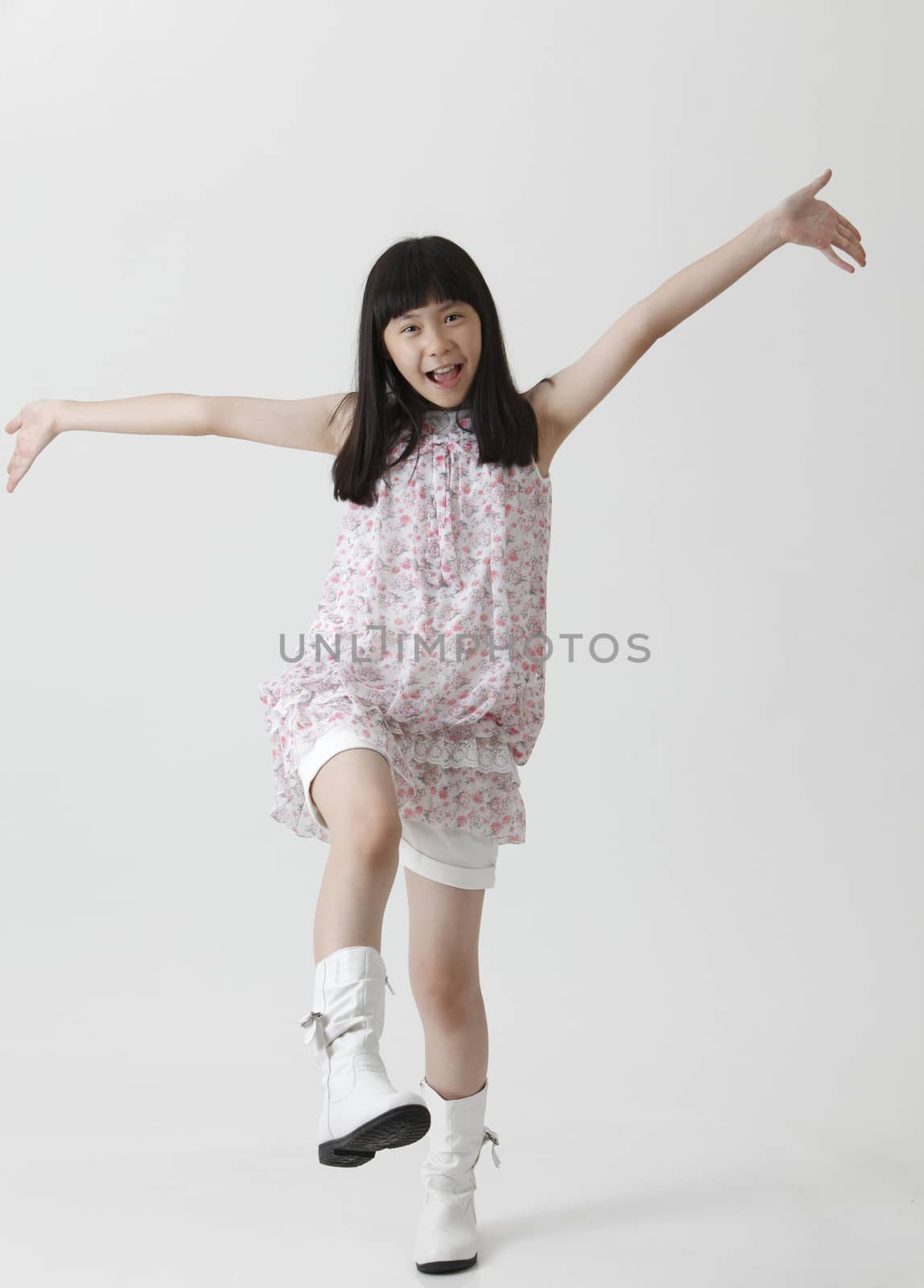 Happy  Asian Chinese girl arms opened looking up