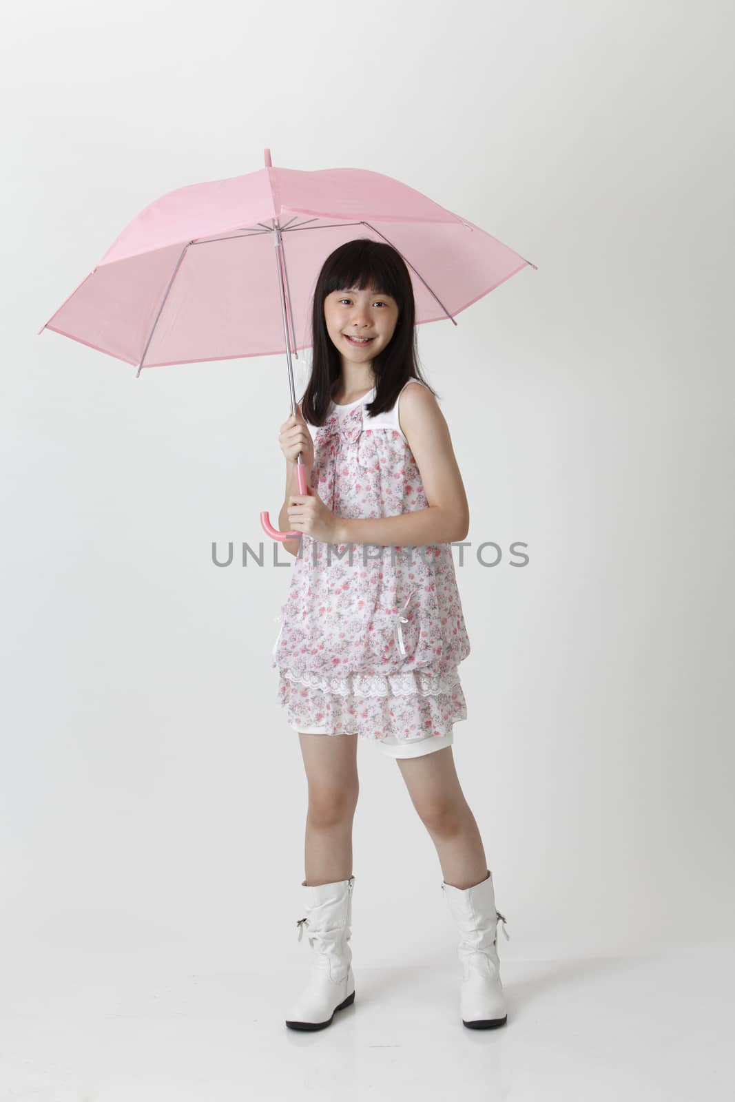 girl holding umbrella by eskaylim