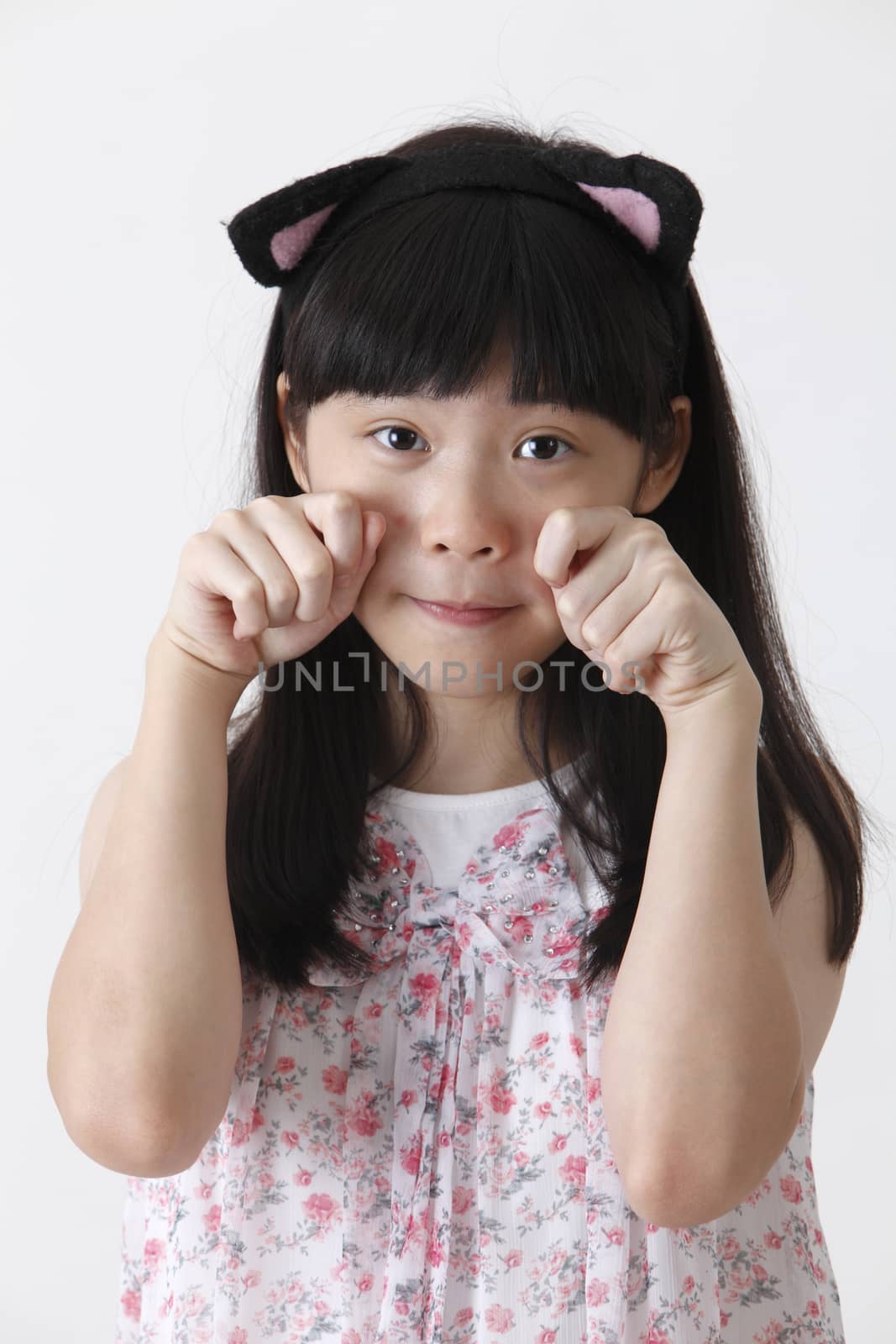 chinese girl wearing cute hair band looking at camera