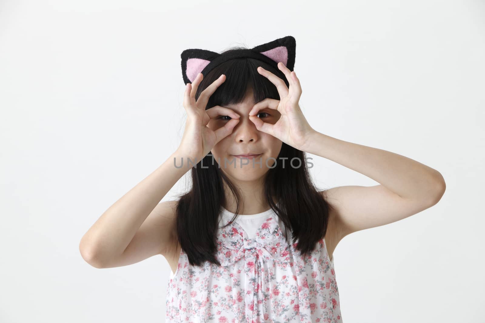 chinese girl wearing cute hair band looking at camera