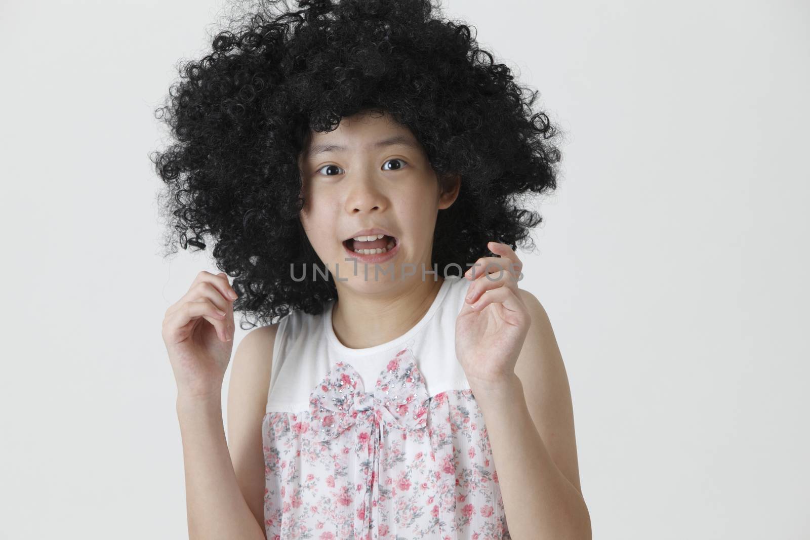 chinese girl wearing a big black wig surprise