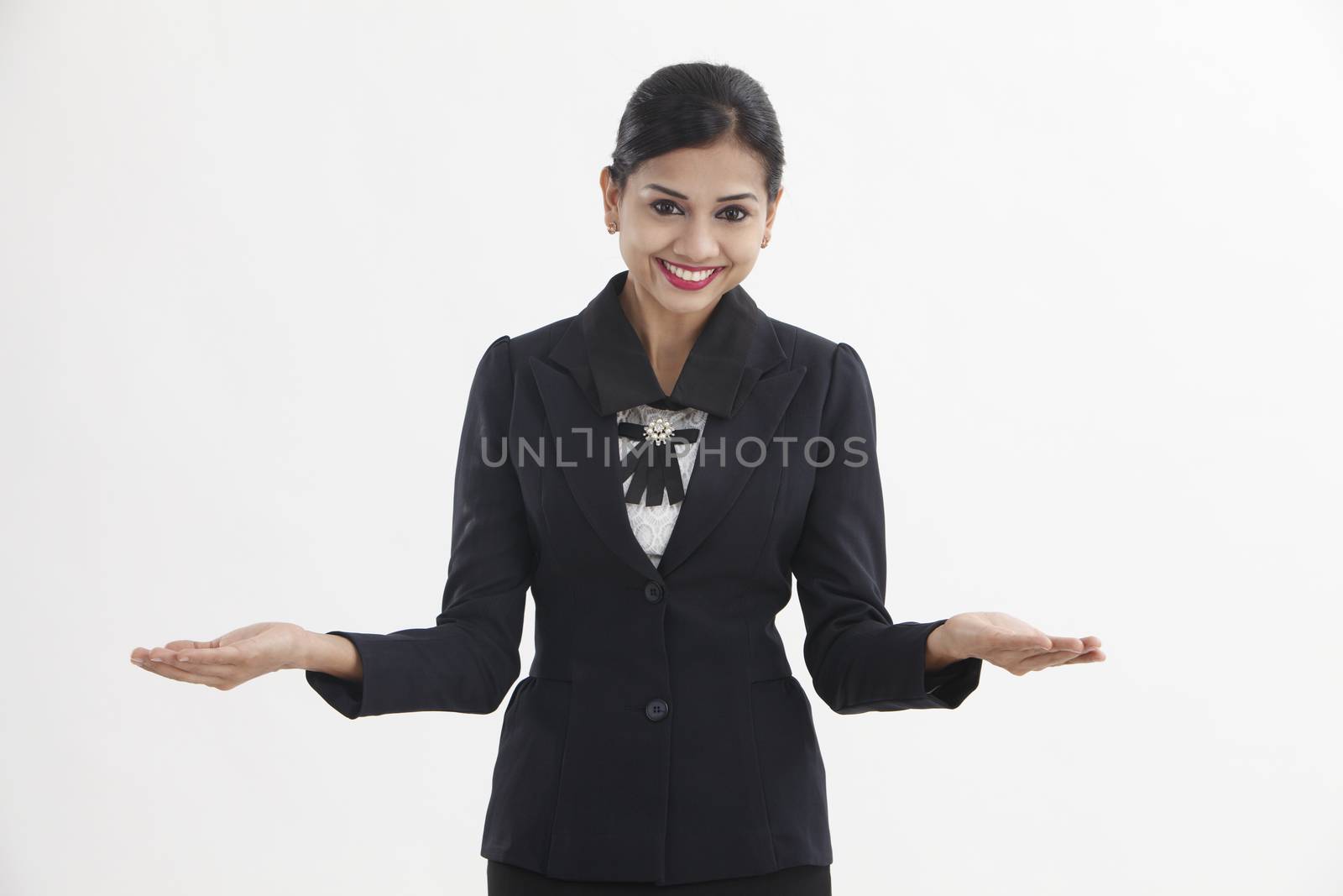 woman making a scale with her arms wide open, isolated in a white background