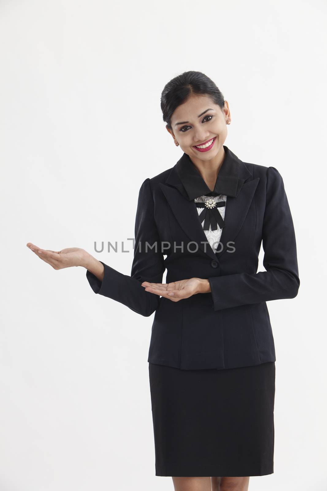 front view of indian businesswoman showing direction