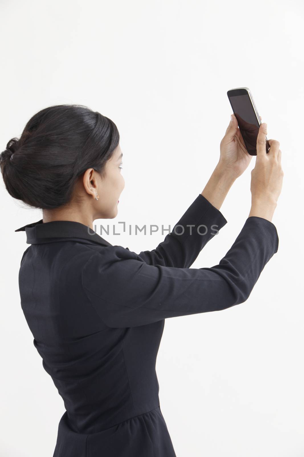 Side view business woman self portrait with smart phone