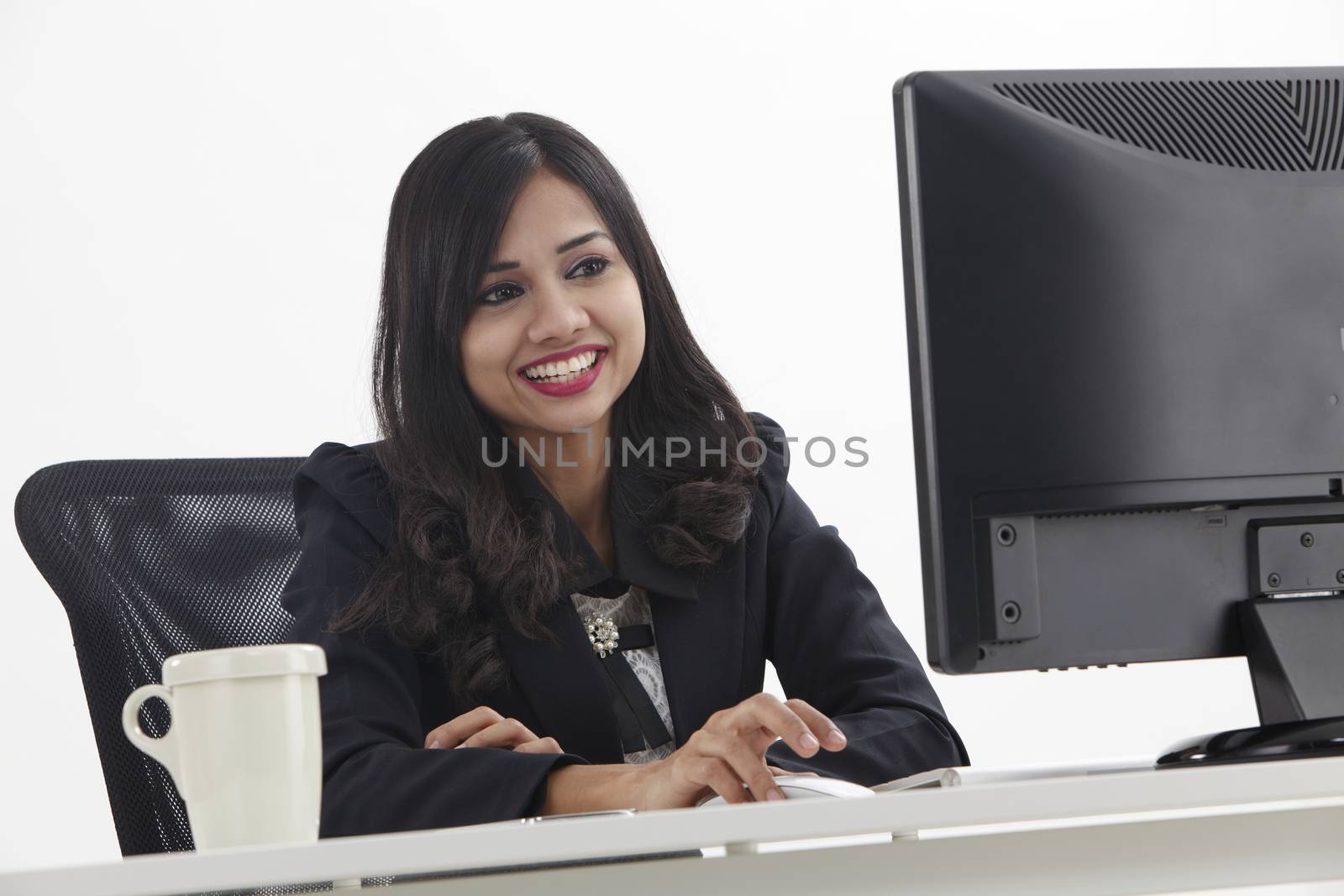business woman sitting in front monitor