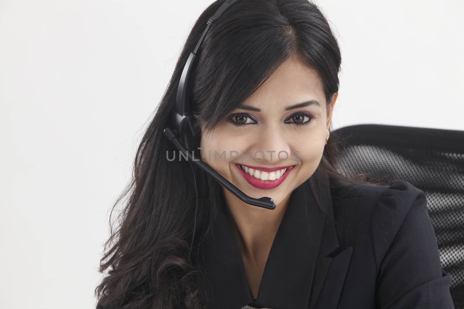 beatiful receptionist wearing headset smiling