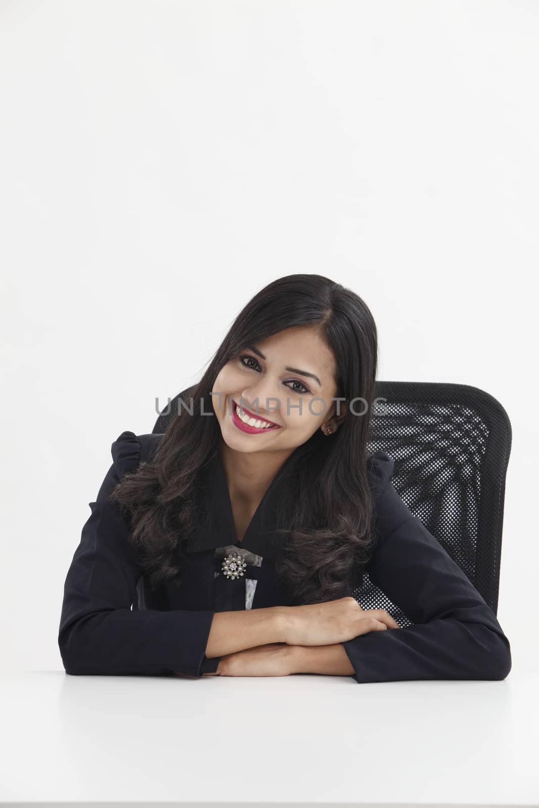 businesswoman sitting and looking to the camera