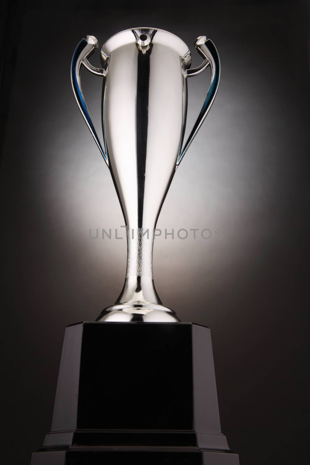 low angle of trophy with glow at the background