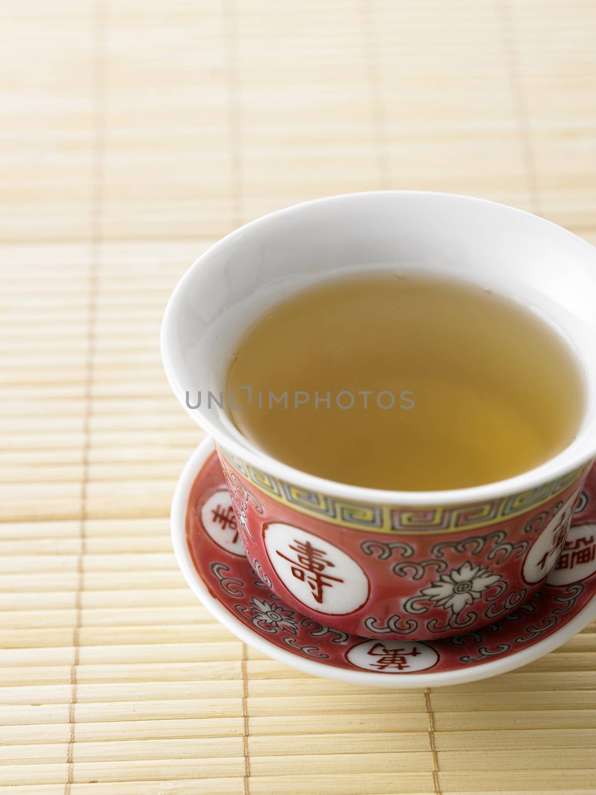 chinese tea cup on the bamboo mat