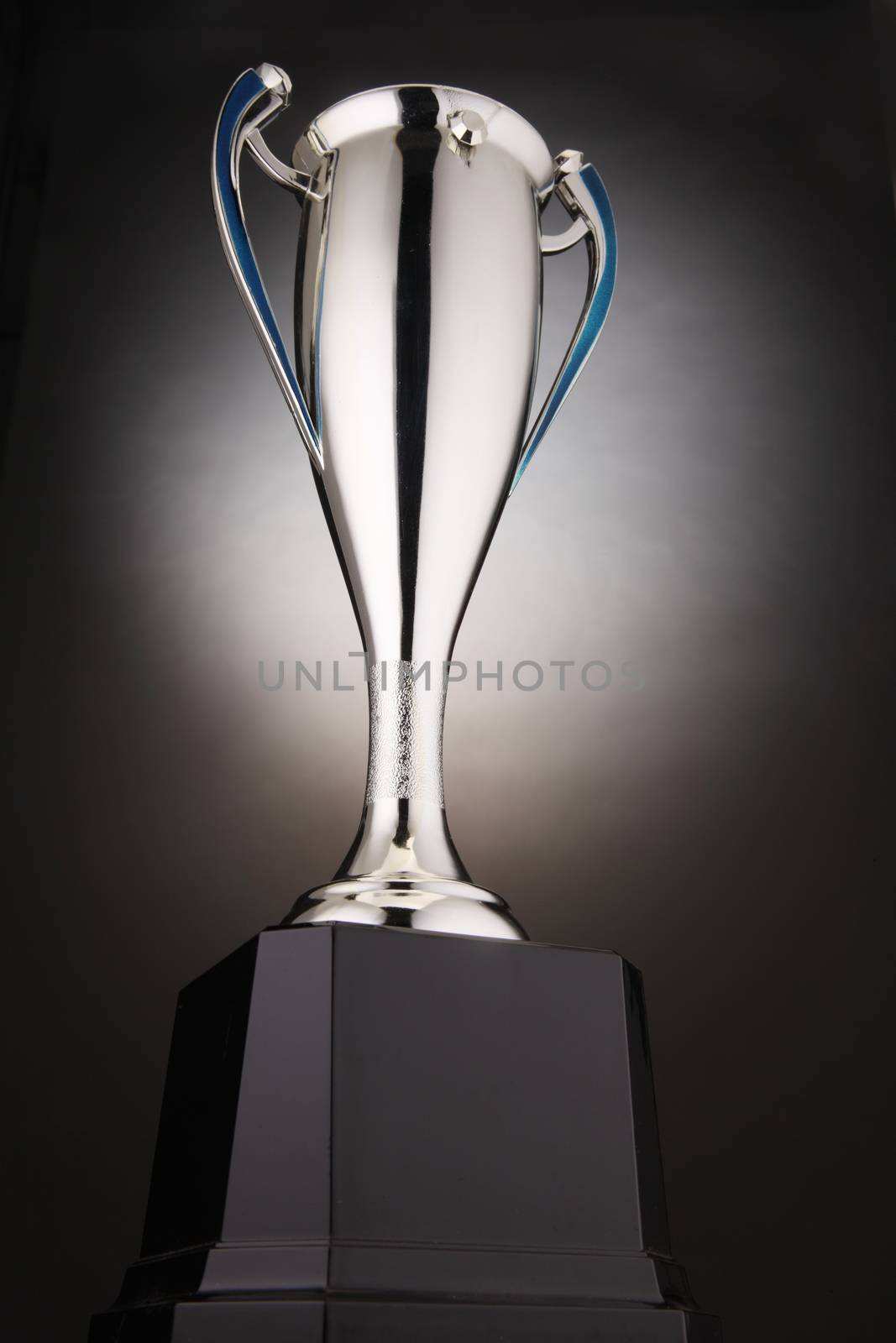 low angle of trophy with glow at the background