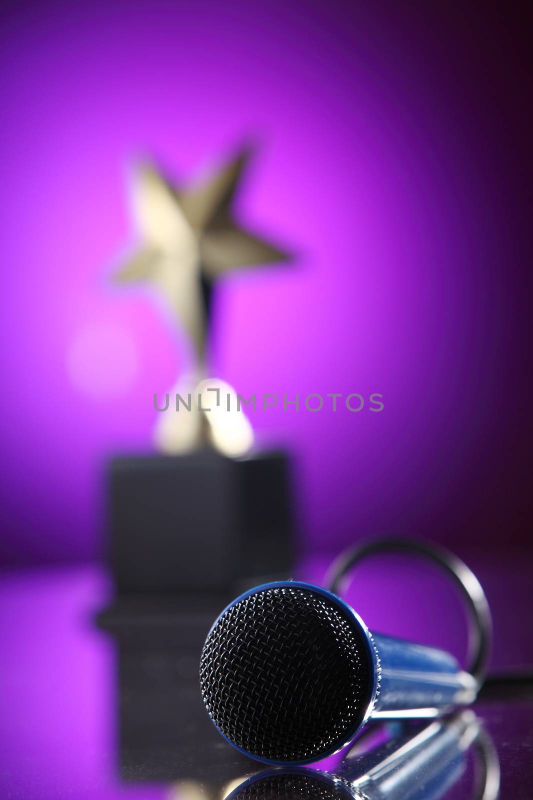 star shape trophy and microphone