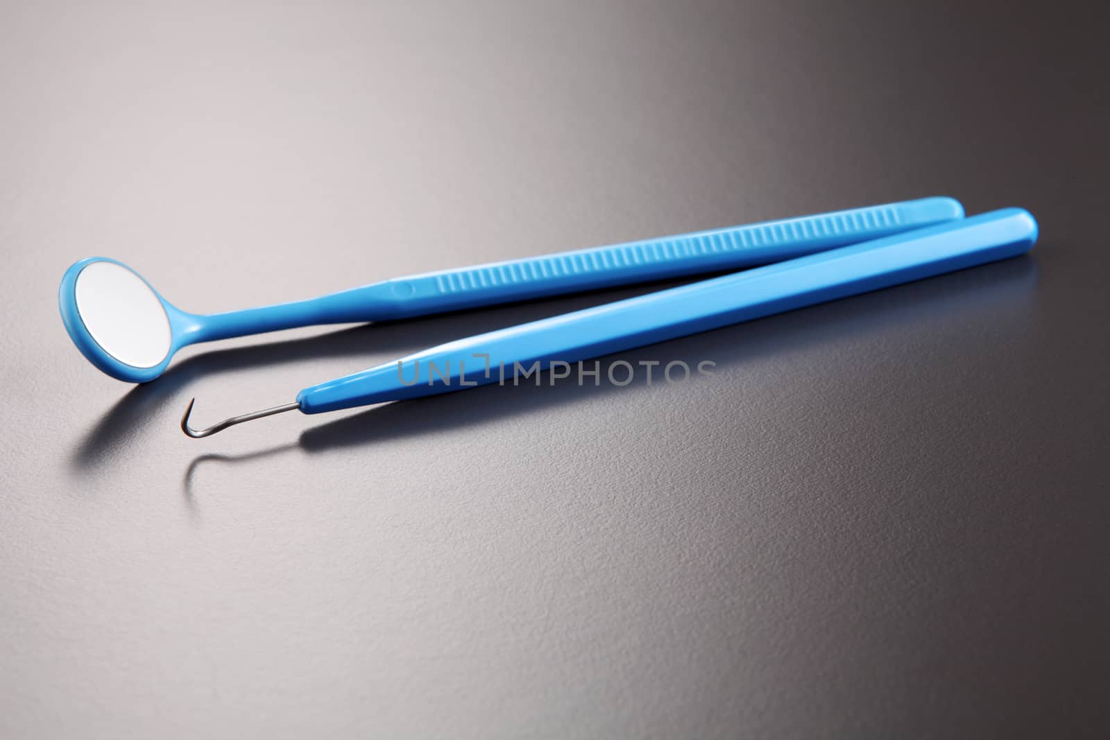 Basic dentist tools isolated on gray