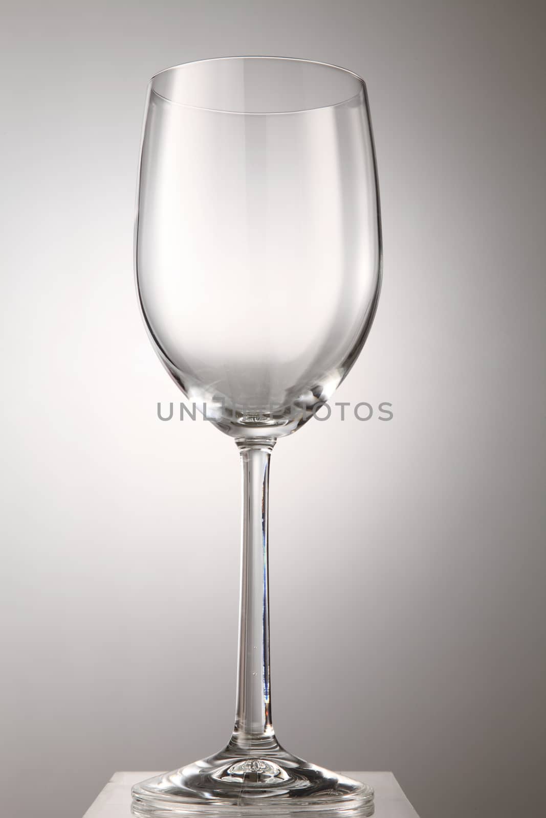 Empty wine glass isolated on white