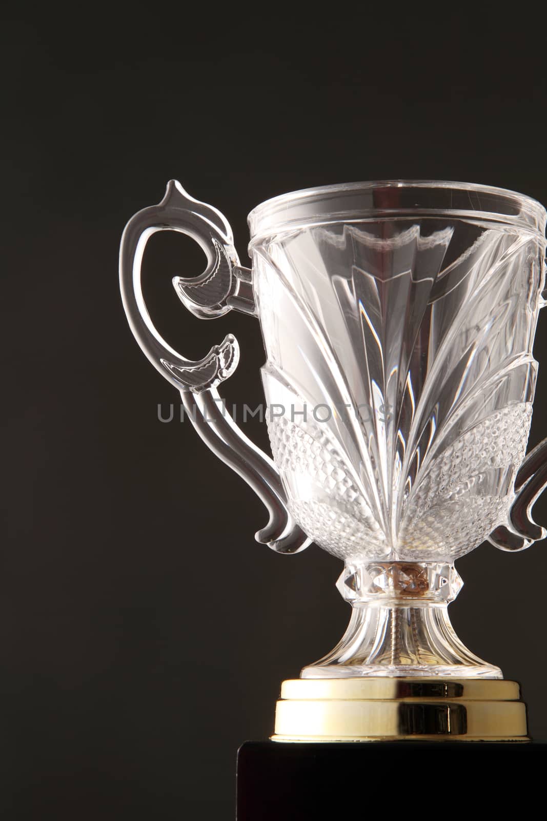 glass trophy on the black background