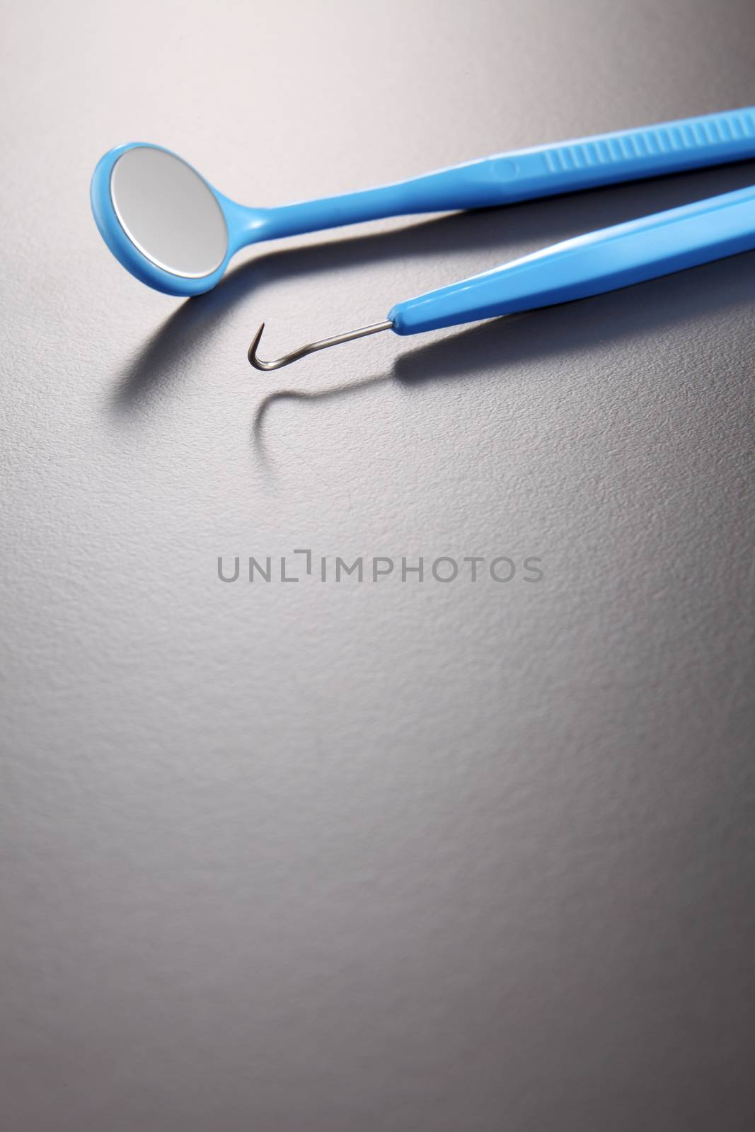 Basic dentist tools isolated on gray