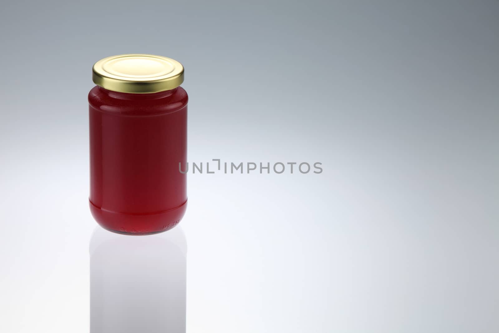 Strawberry jam jar isolated on white background