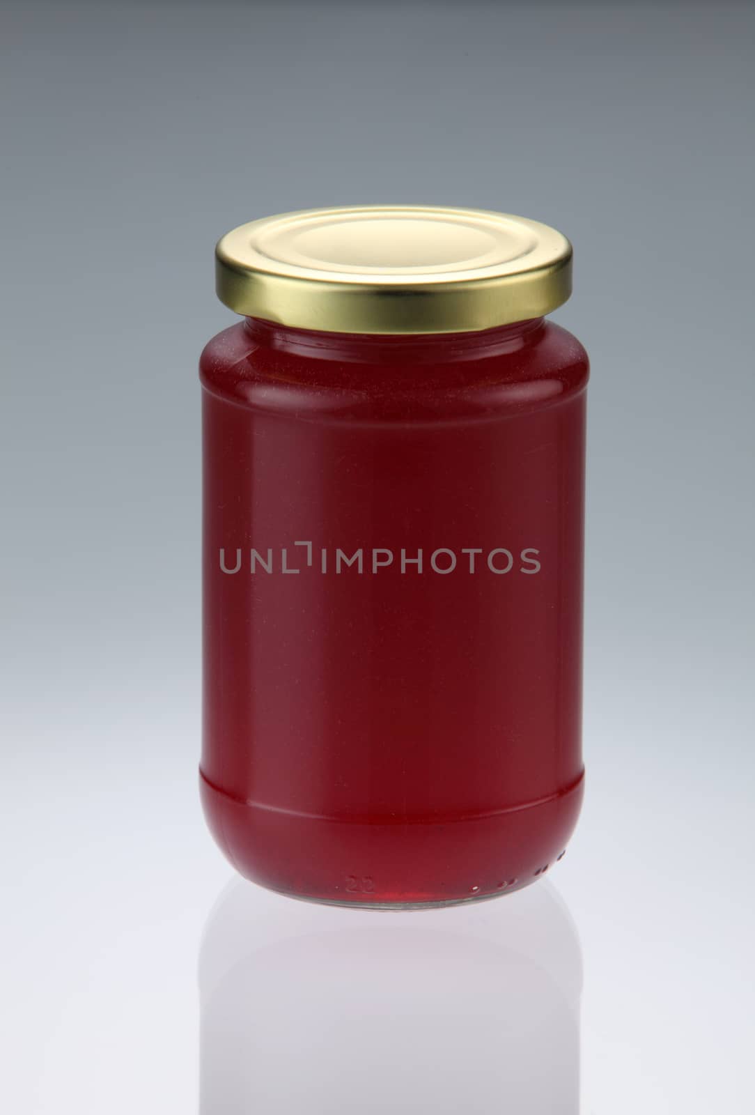 Strawberry jam jar isolated on white background