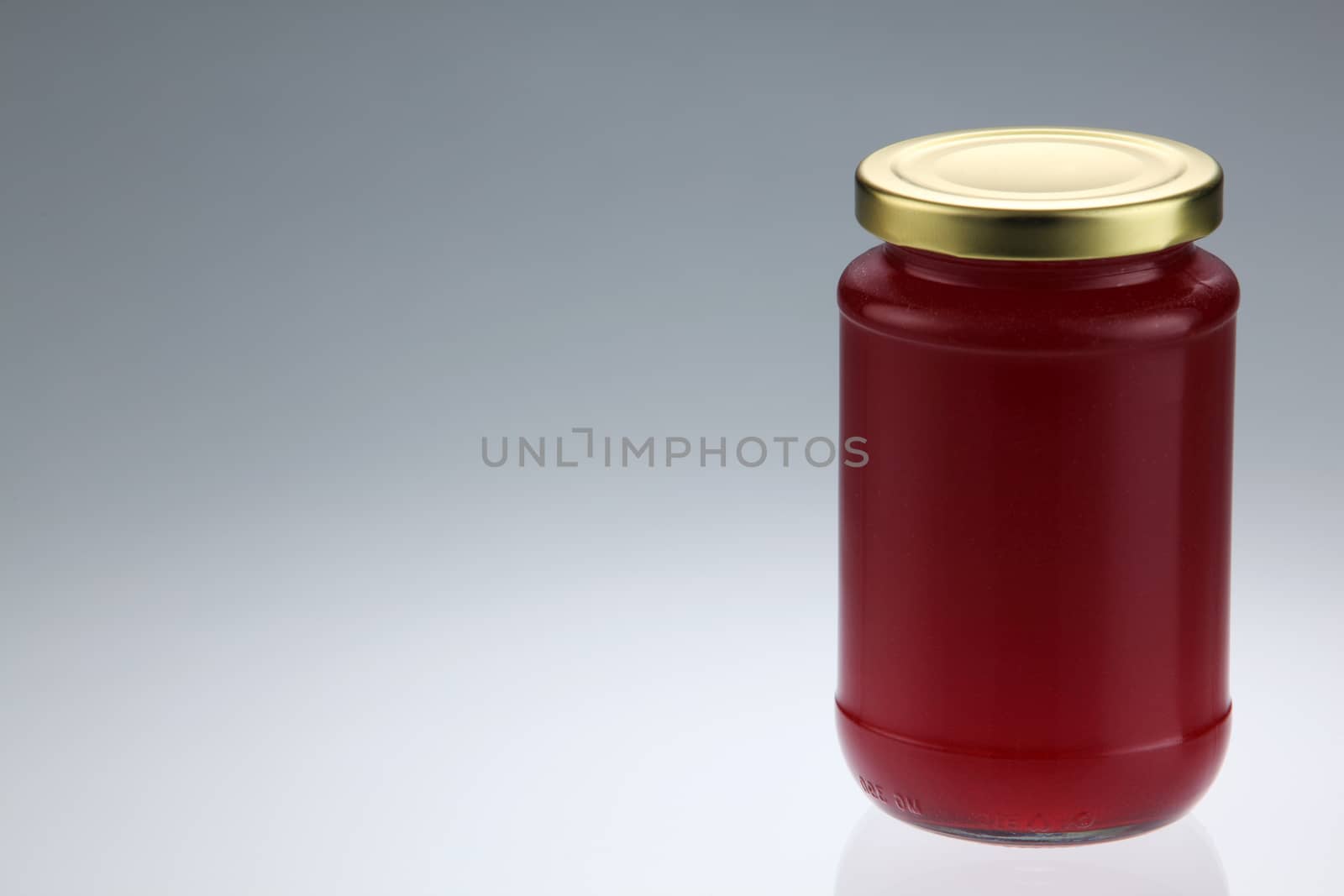 Strawberry jam jar isolated on white background