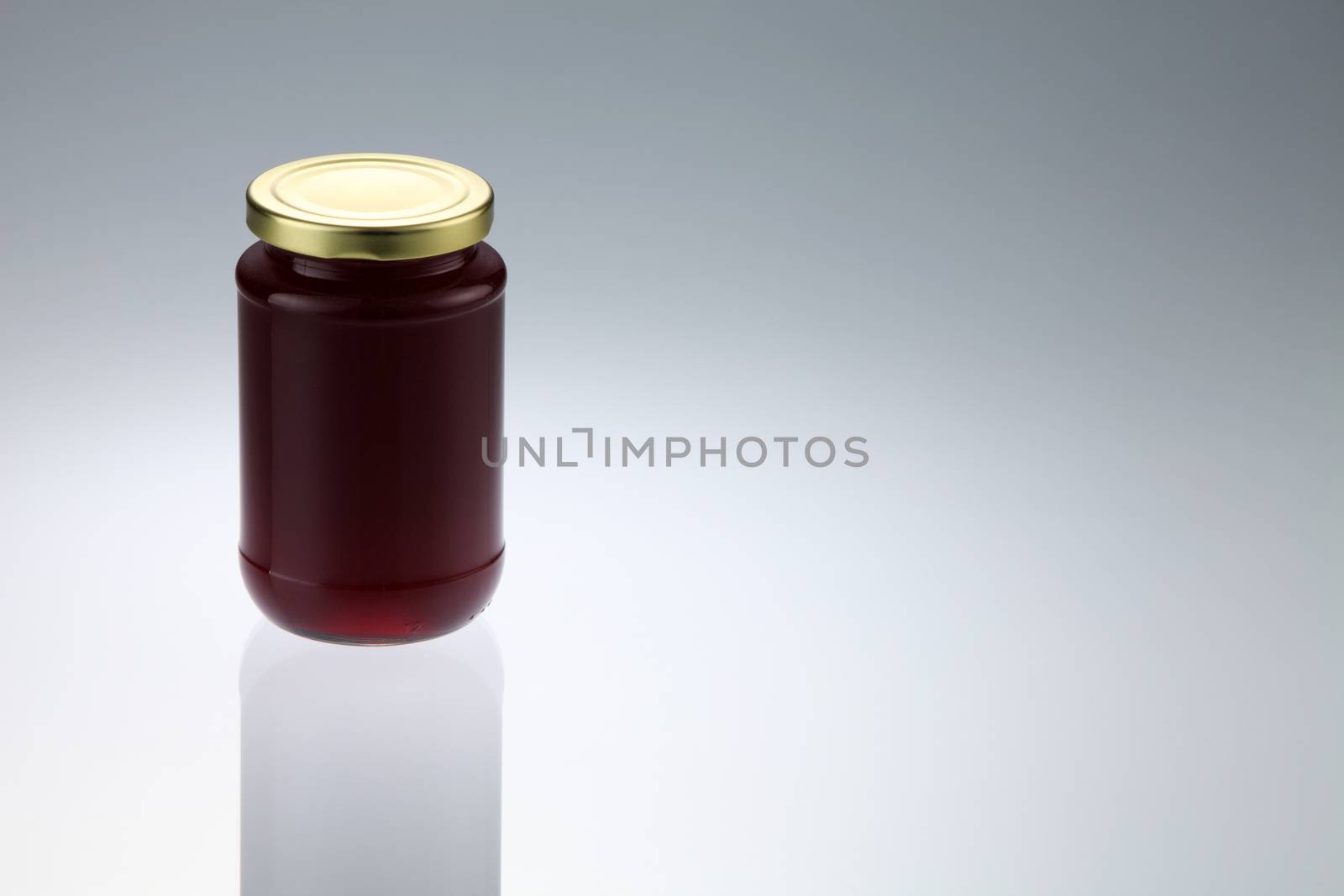 cranberry fruit jam in the glass container