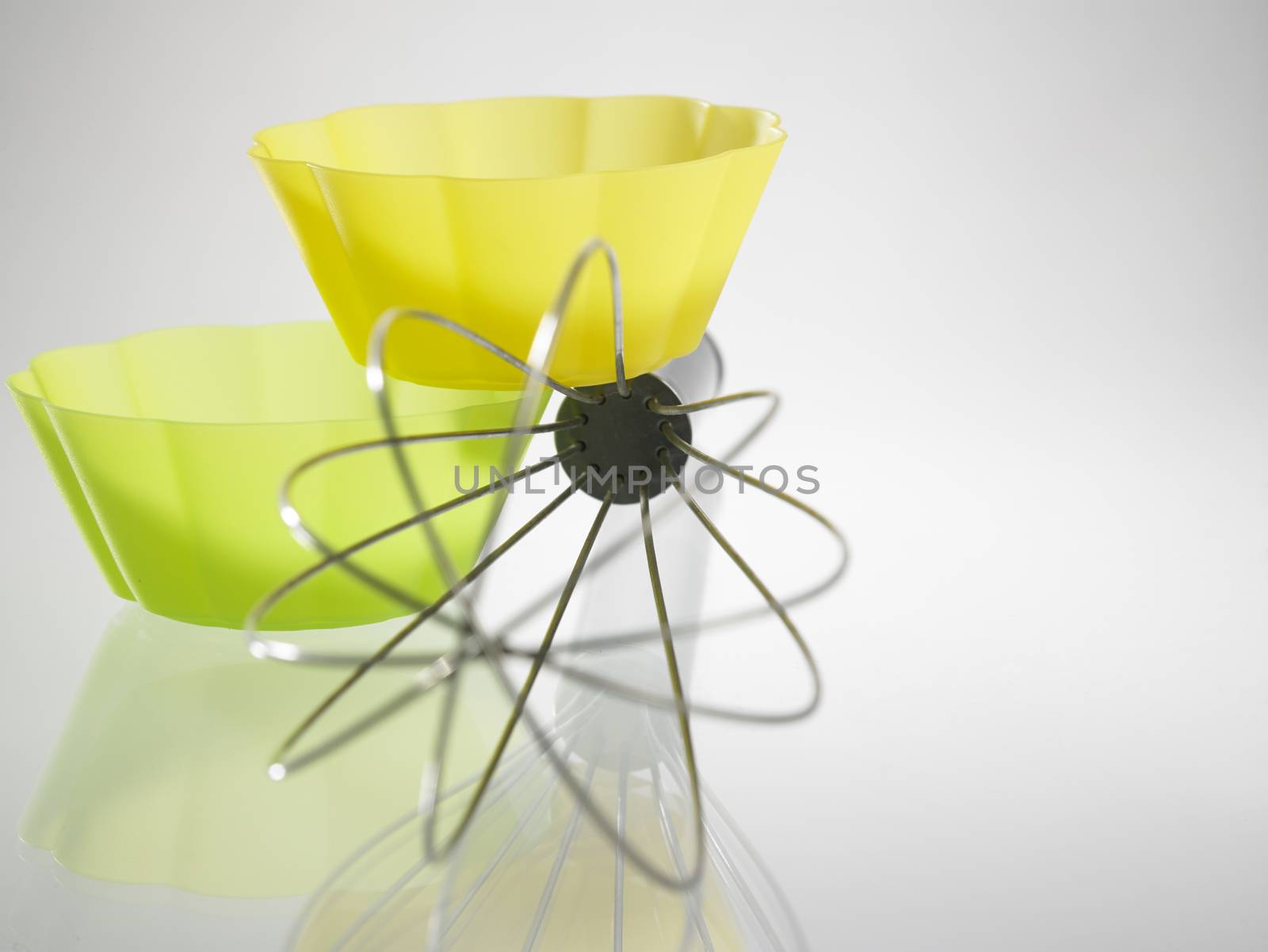 whisk and the silicone muffin holder