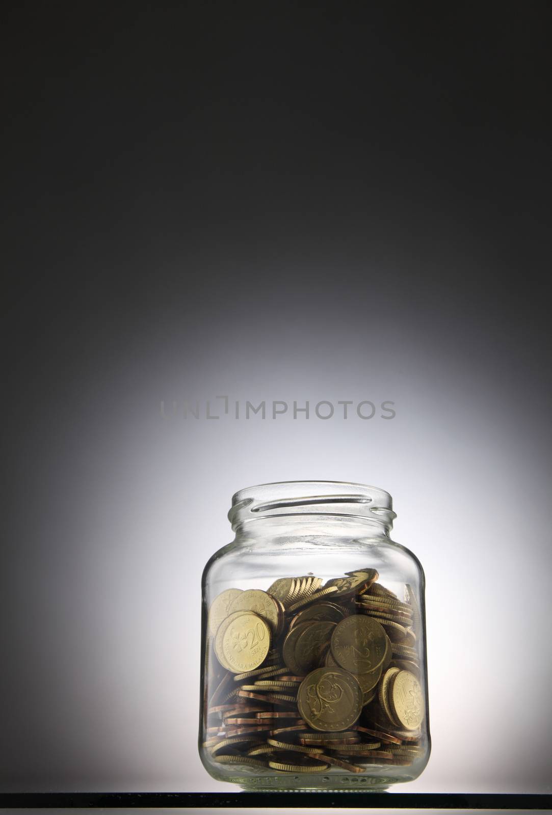 money or coins in the saving jar