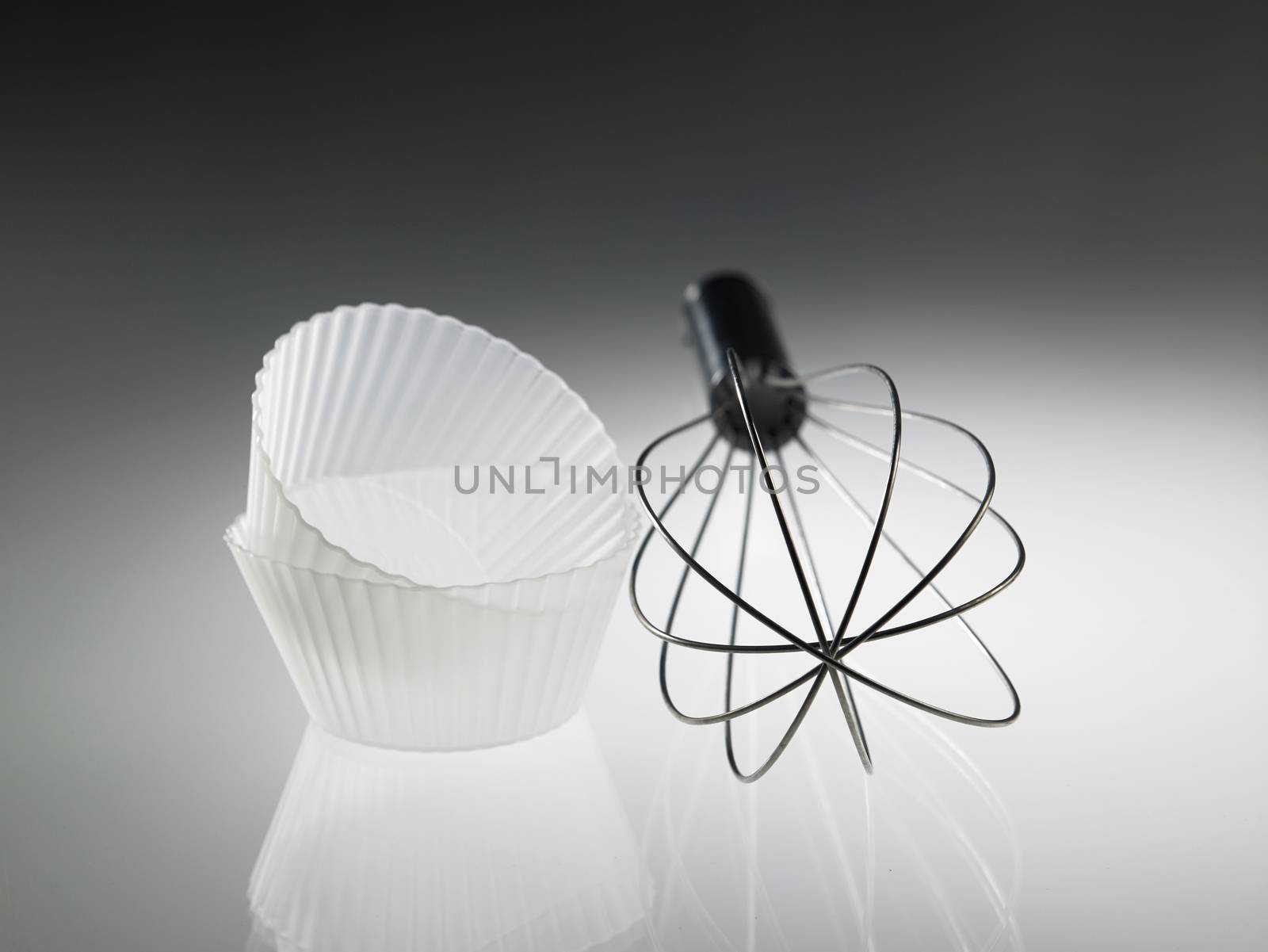 whisk and the silicone muffin holder