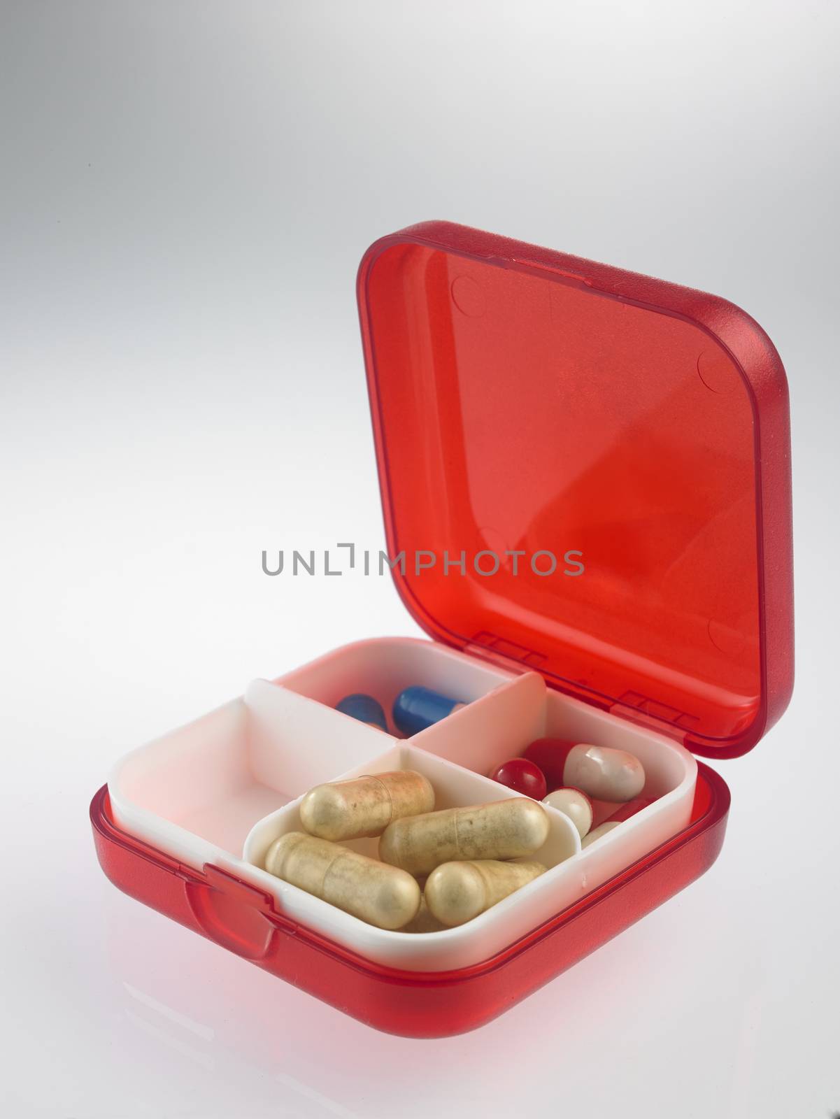 red pill box with medicine