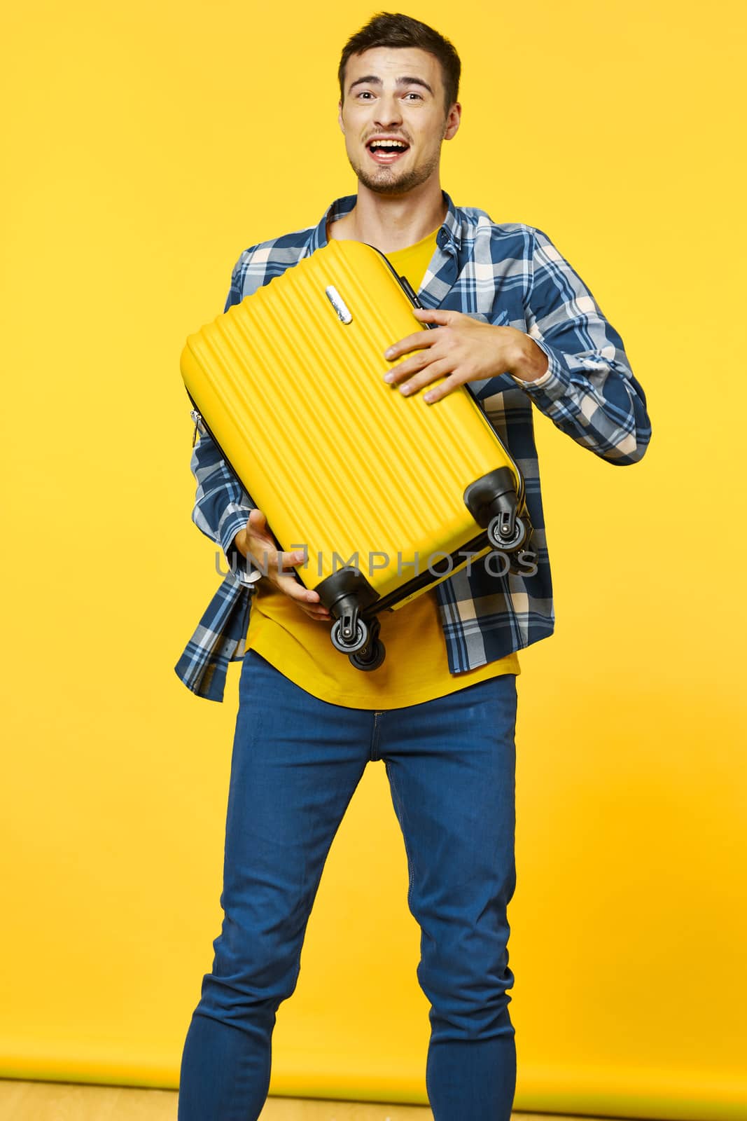 Man with yellow suitcase tourism travel passenger yellow isolated background flight