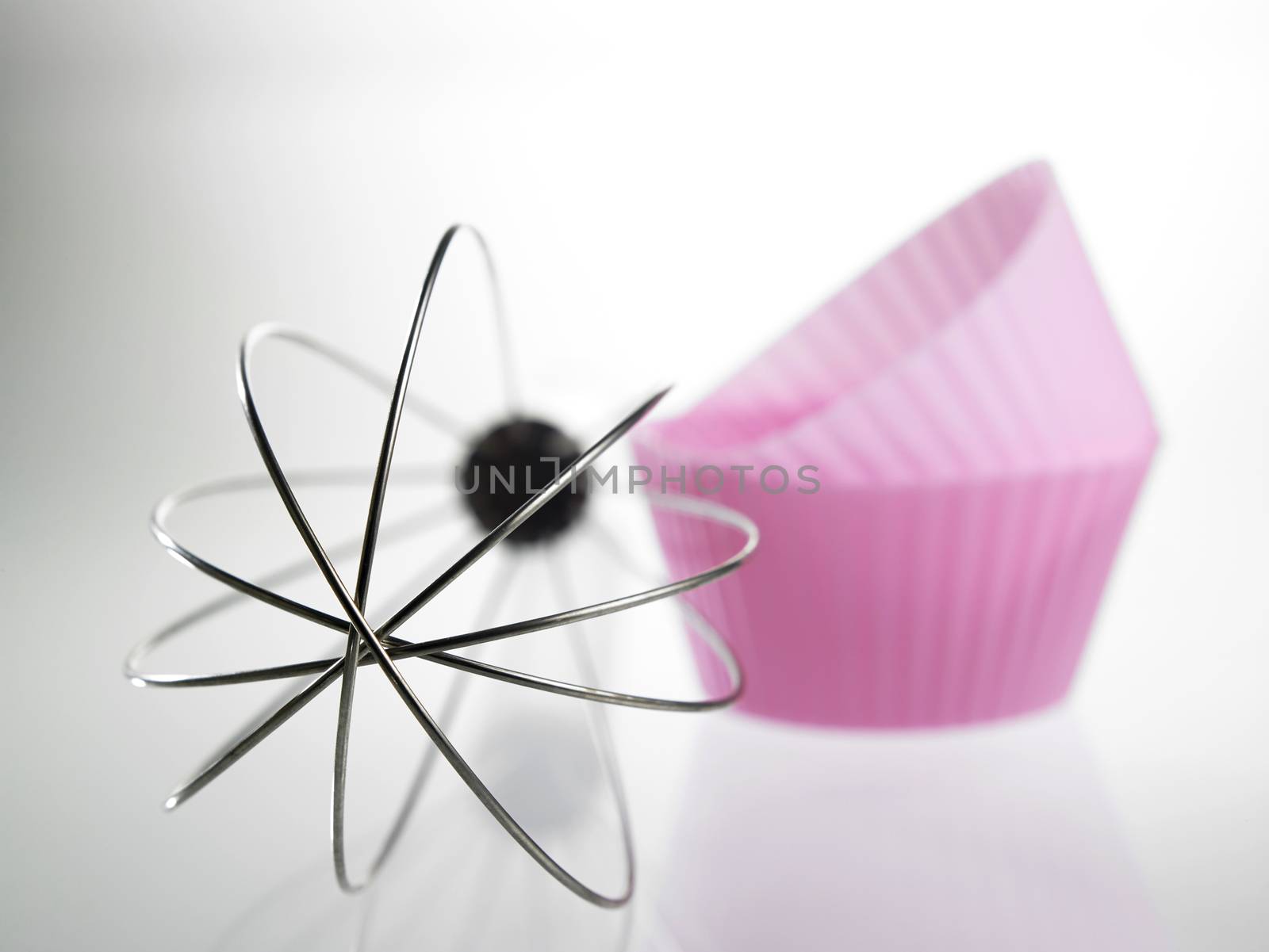whisk and the silicone muffin holder