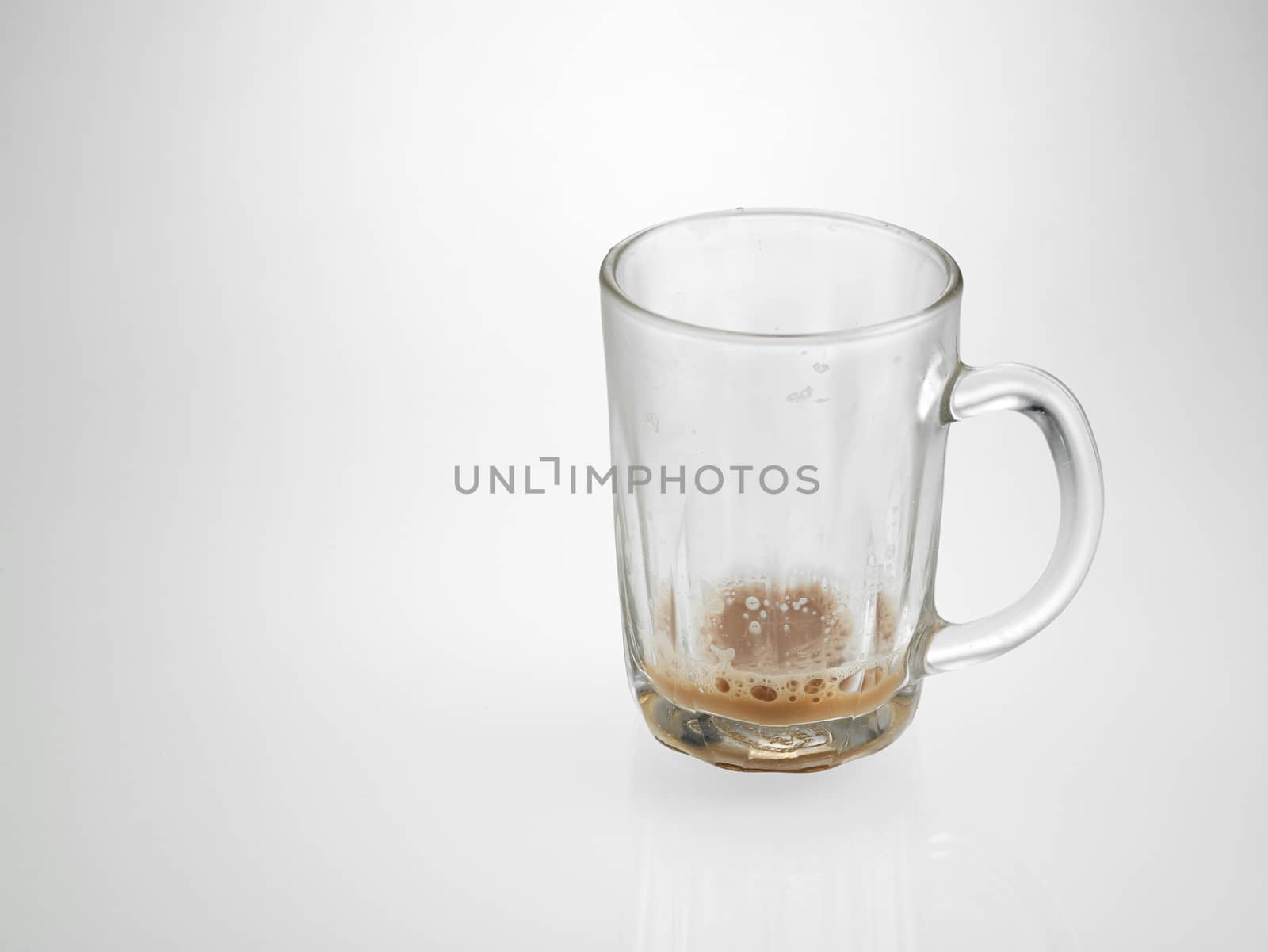 glass with little Tea with milk or Teh Tarik in Malaysia