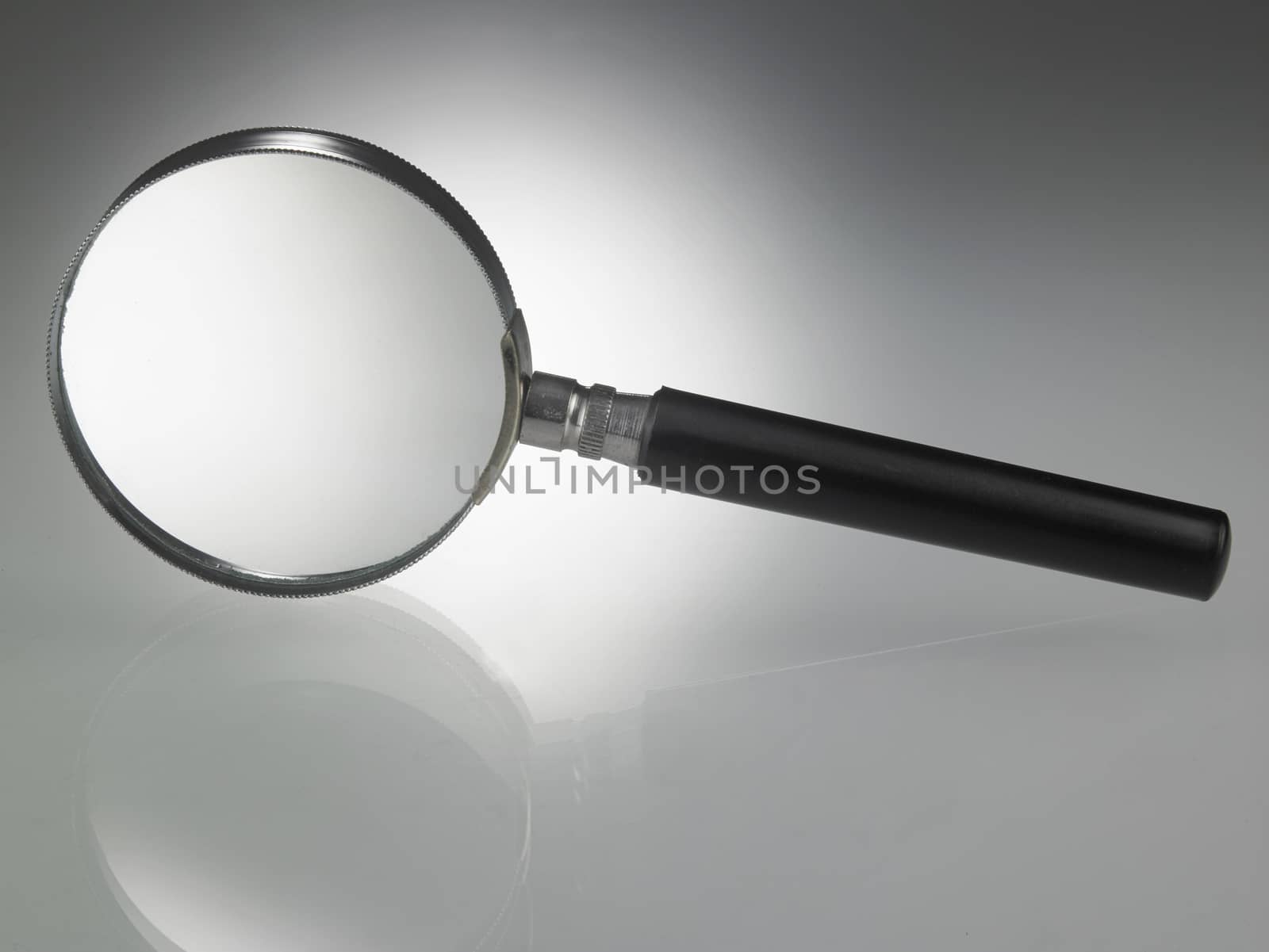 Magnifying glass on top of glass table